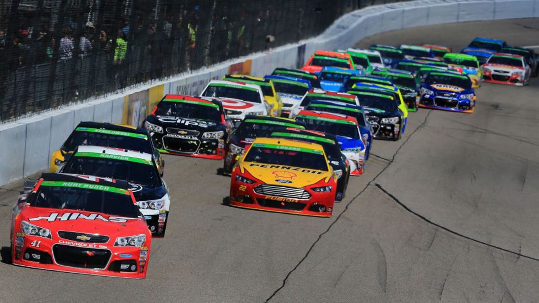 RICHMOND, VA - APRIL 26: Kurt Busch, driver of the #41 Haas Automation Chevrolet, leads a pack of cars during the NASCAR Sprint Cup Series Toyota Owners 400 at Richmond International Raceway on April 26, 2015 in Richmond, Virginia. (Photo by Daniel Shirey/NASCAR via Getty Images)