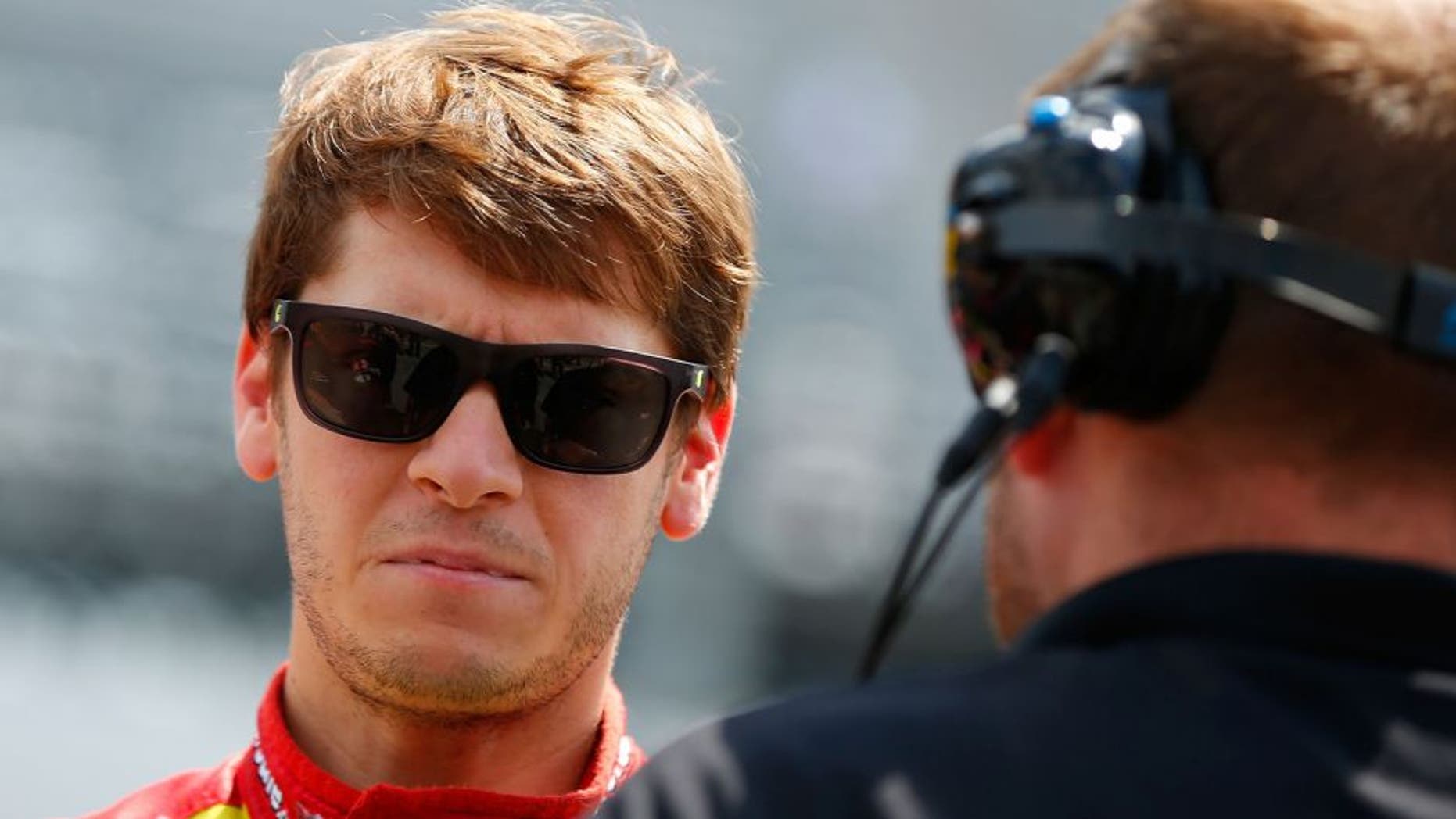 DOVER, DE - MAY 30: Landon Cassill, driver of the #01 Meding's Seafood/Iron Source Chevrolet, left, talks with a crew member on the grid during qualifying for the NASCAR XFINITY Series Buckle Up 200 presented by Click It or Ticket at Dover International Speedway on May 30, 2015 in Dover, Delaware. (Photo by Matt Sullivan/NASCAR via Getty Images)