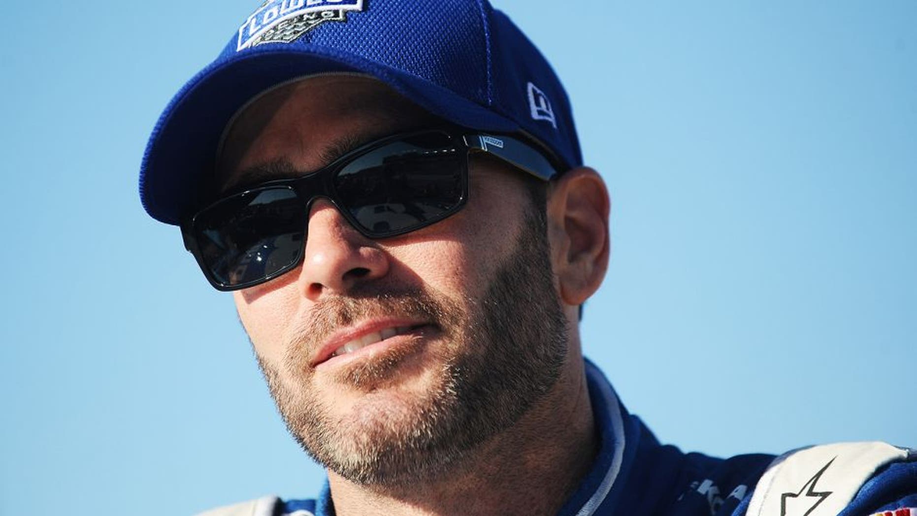 RICHMOND, VA - SEPTEMBER 11: Jimmie Johnson, driver of the #48 Lowe's Chevrolet, stands on the grid during qualifying for the NASCAR Sprint Cup Series Federated Auto Parts 400 at Richmond International Raceway on September 11, 2015 in Richmond, Virginia. (Photo by Rainier Ehrhardt/NASCAR via Getty Images)