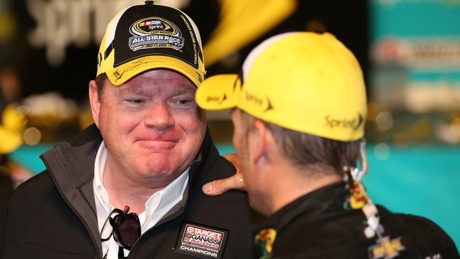 CHARLOTTE, NC - MAY 17: Chip Ganassi (L), owner of Chip Ganassi Racing, talks so Jamie McMurray, driver of the #1 Bass Pro Chevrolet, in victory lane after the NASCAR Sprint Cup Series Sprint All-Star Race at Charlotte Motor Speedway on May 17, 2014 in Charlotte, North Carolina. (Photo by Chris Graythen/Getty Images)