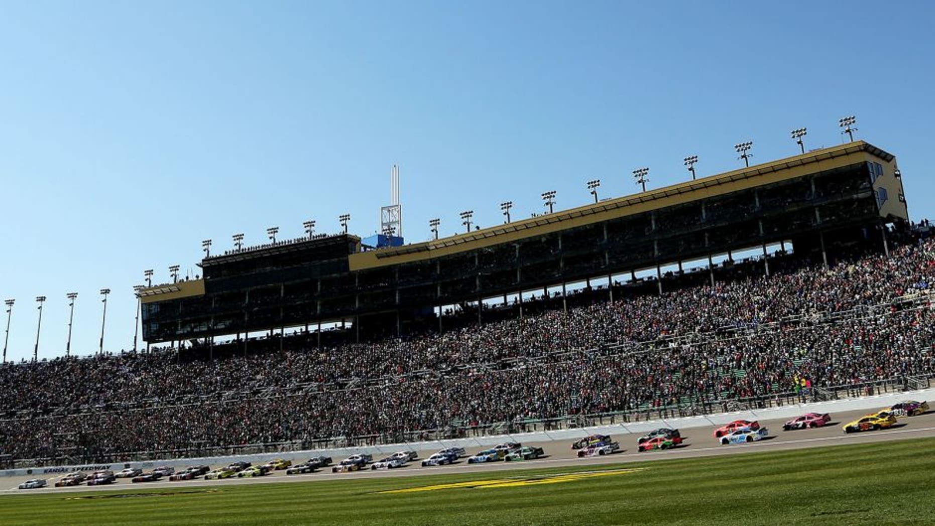 KANSAS CITY, KS - OCTOBER 18: General view as Brad Keselowski, driver of the #2 Miller Lite Ford, leads the field past the green flag to start the NASCAR Sprint Cup Series Hollywood Casino 400 at Kansas Speedway on October 18, 2015 in Kansas City, Kansas. (Photo by Jerry Markland/Getty Images)