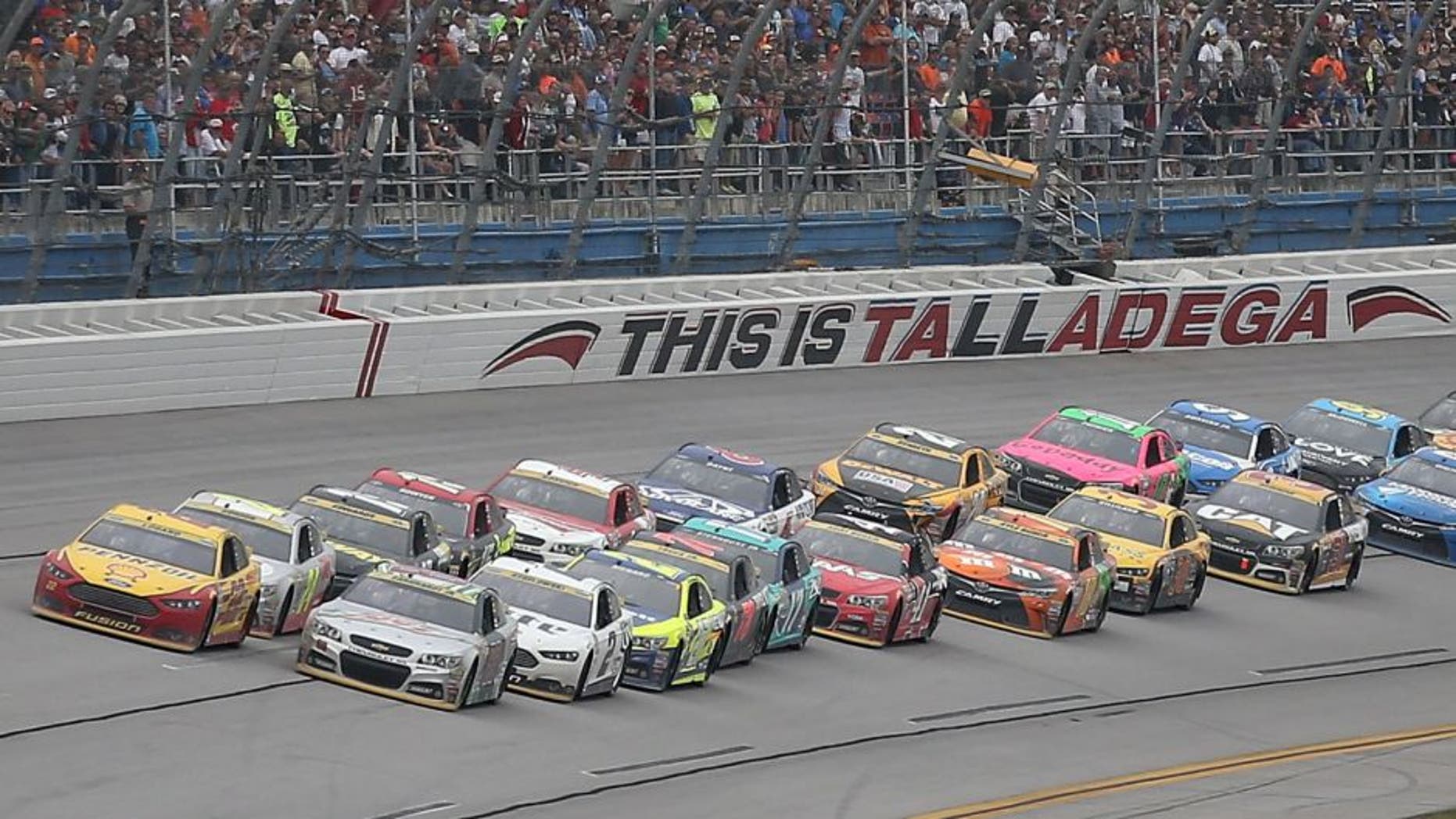 TALLADEGA, AL - OCTOBER 25: Joey Logano, driver of the #22 Shell Pennzoil Ford, and Dale Earnhardt Jr., driver of the #88 Diet Mountain Dew Chevrolet, lead the field on the final restart during the NASCAR Sprint Cup Series CampingWorld.com 500 at Talladega Superspeedway on October 25, 2015 in Talladega, Alabama. (Photo by Chris Graythen/NASCAR via Getty Images)