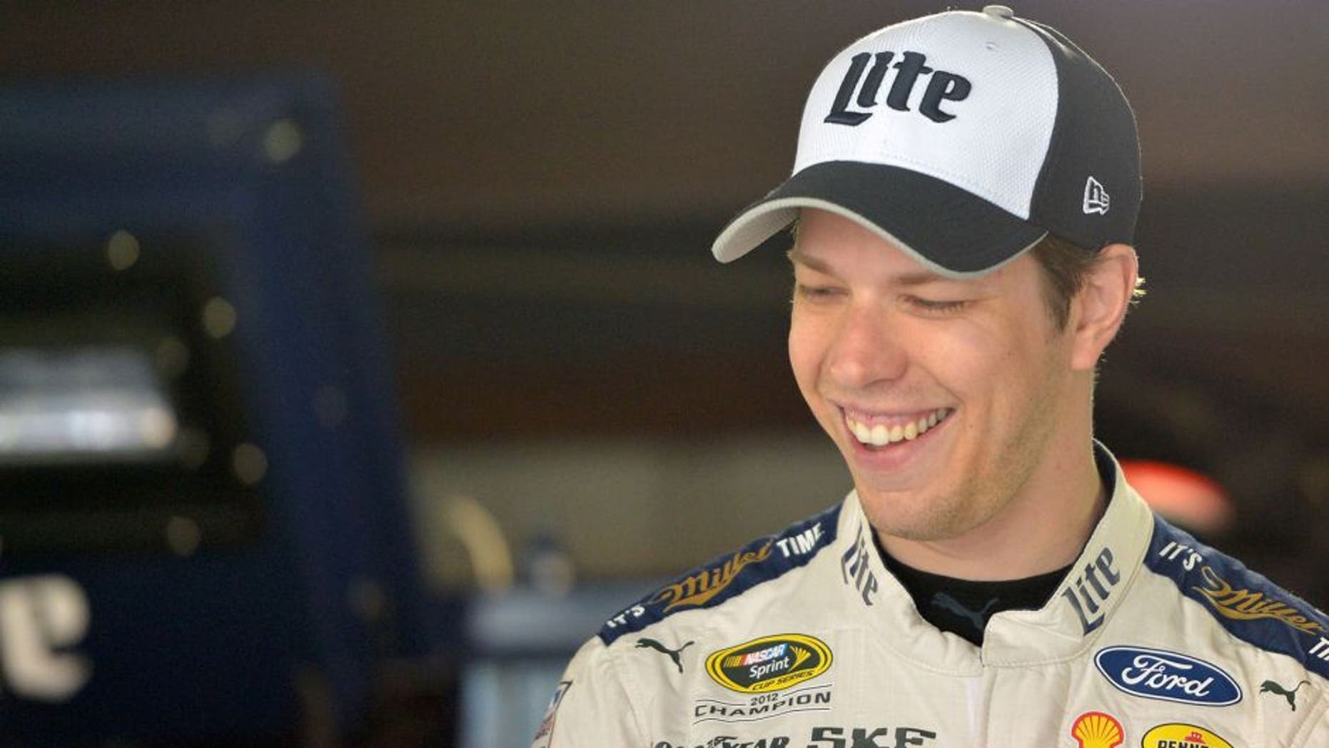 MARTINSVILLE, VA - APRIL 02: Brad Keselowski, driver of the #2 Miller Lite Ford, stands in the garage area during practice for the NASCAR Sprint Cup Series STP 500 at Martinsville Speedway on April 2, 2016 in Martinsville, Virginia. (Photo by Drew Hallowell/Getty Images)
