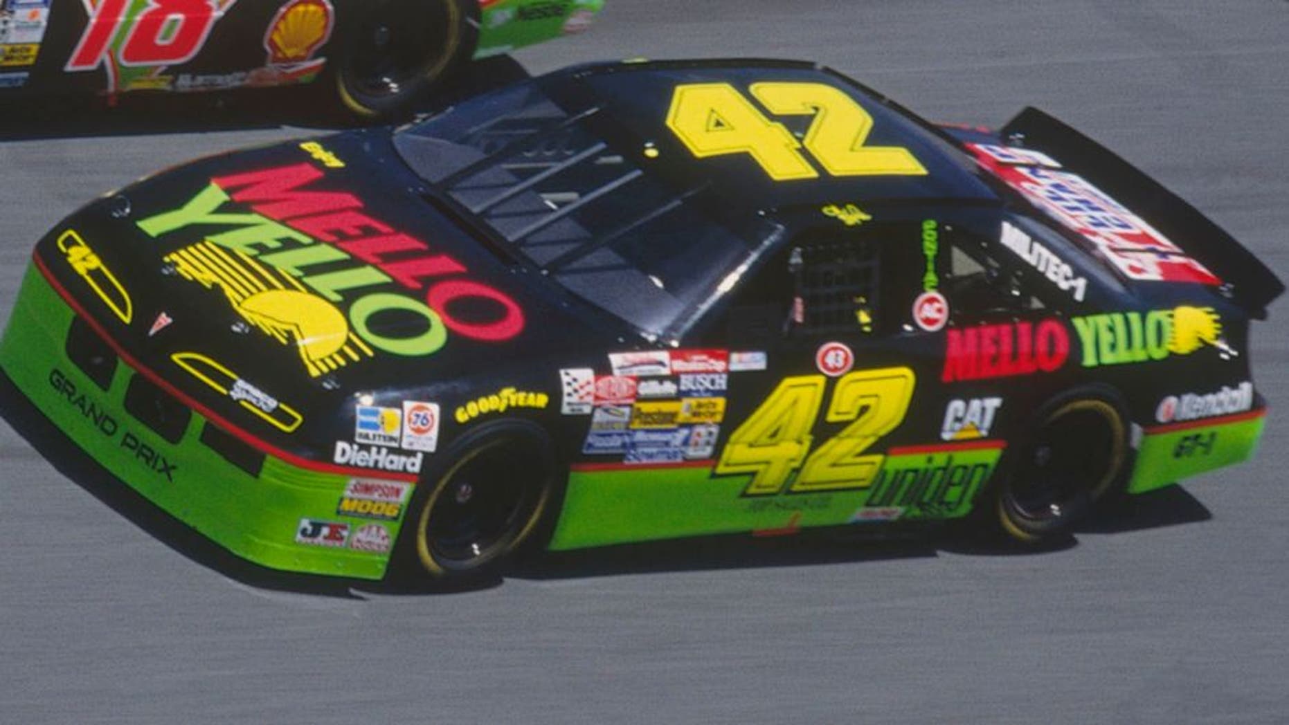 DAYTONA BEACH, FL - FEBRUARY 14: Dale Jarrett drives his Interstate Batteries #18 car down a turn against Kyle Petty in his Mello Yello #42 car during the Daytona 500 at the Daytona Speedway on February 14, 1993 in Daytona Beach, Florida. (Photo by Focus on Sport/Getty Images)