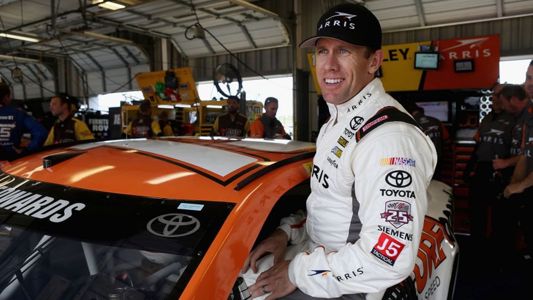 SPARTA, KY - JULY 07: Carl Edwards, driver of the #19 ARRIS Surfboard Toyota, climbs into his car during practice for the NASCAR Sprint Cup Series Quaker State 400 at Kentucky Speedway on July 7, 2016 in Sparta, Kentucky. (Photo by Dylan Buell/Getty Images)