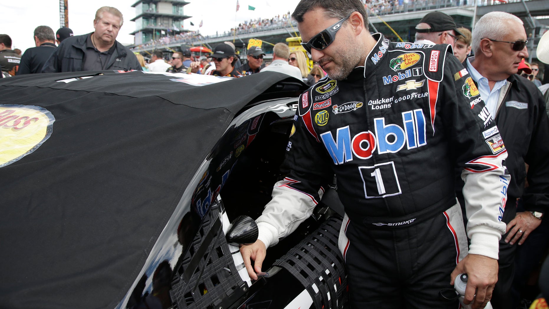 Sprint Cup Series driver Tony Stewart prepares for the Brickyard 400 auto race at the Indianapolis Motor Speedway in Indianapolis, Sunday, July 28, 2013. (AP Photo/Darron Cummings)