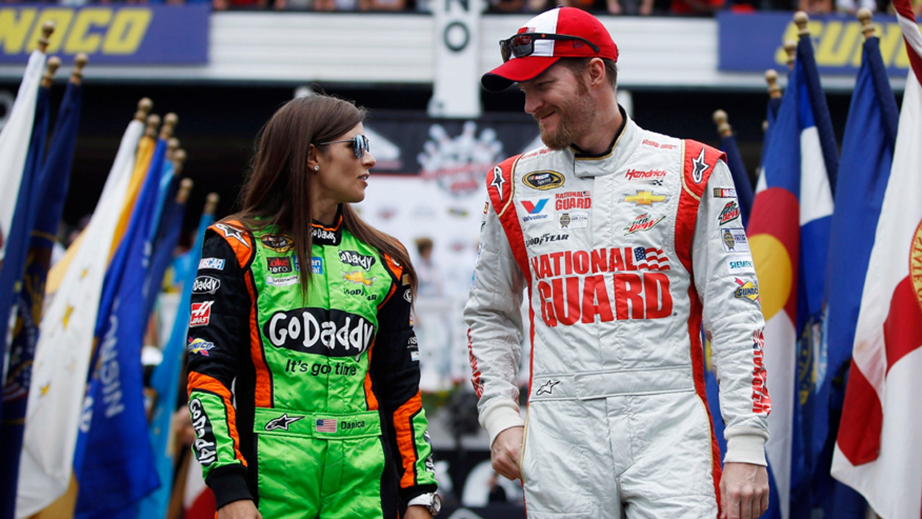 FILE - In this Aug. 3, 2014 file photo, Dale Earnhardt Jr., right, and Danica Patrick talk during driver introductions before the NASCAR Sprint Cup Series auto race at Pocono Raceway in Long Pond, Pa. The relationship between Earnhardt and Patrick will need repairing after a couple of on-track incidents late in the Saturday, July 11, 2015 race at Kentucky Speedway that left both with damaged Chevys, low finishes and a little bad blood between them. (AP Photo/Matt Slocum, File)