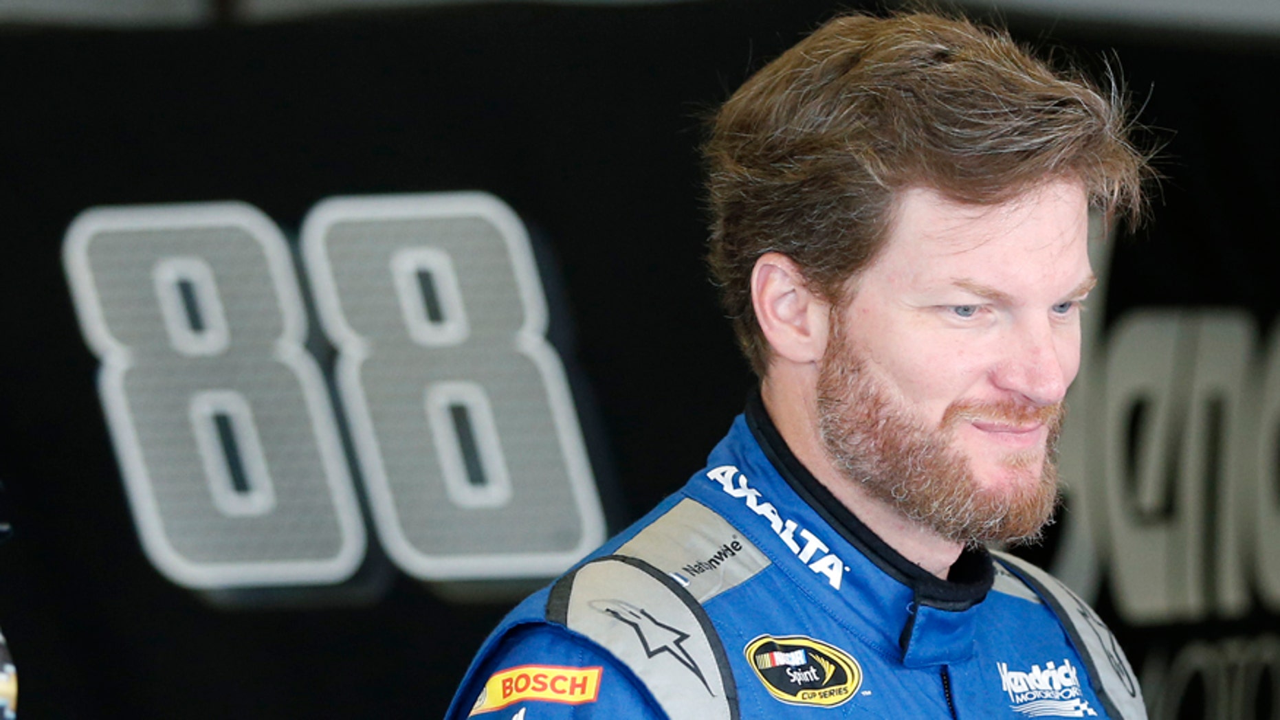 Dale Earnhardt Jr. prepares himself before the start of practice at Daytona International Speedway, Friday, July 1, 2016, in Daytona Beach, Fla. (AP Photo/Wilfredo Lee)