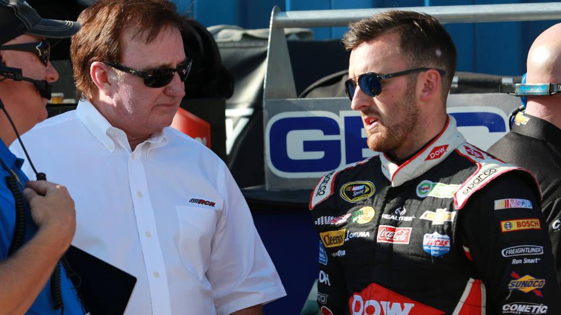 FILE - In this Aug. 15, 2015, file photo, driver Austin Dillon talks with team owner Richard Childress before a practice session for the NASCAR Sprint Cup series auto race at Michigan International Speedway in Brooklyn, Mich. In a race dominated by Matt Kenseth last weekend, Dillon managed to stand out among the other drivers, and that's a step in the right direction for the young racer. (AP Photo/Dave Frechette, File)