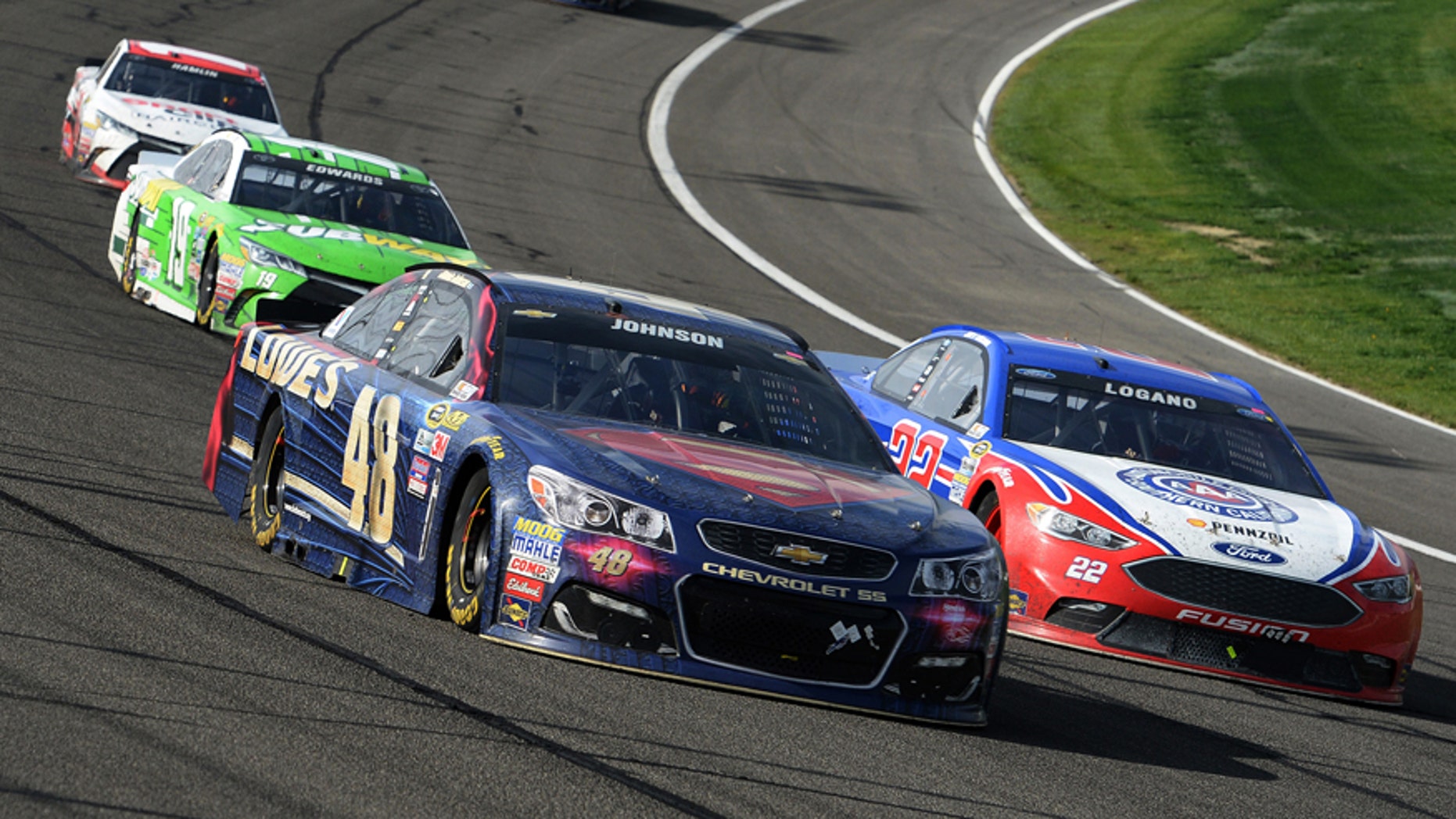 Jimmie Johnson (48) and Joey Logano (22) race for the lead during the late laps of the NASCAR 400 mile auto race Sunday, March 20, 2016, at Auto Club Speedway in Fontana, Calif. (AP Photo/Will Lester)