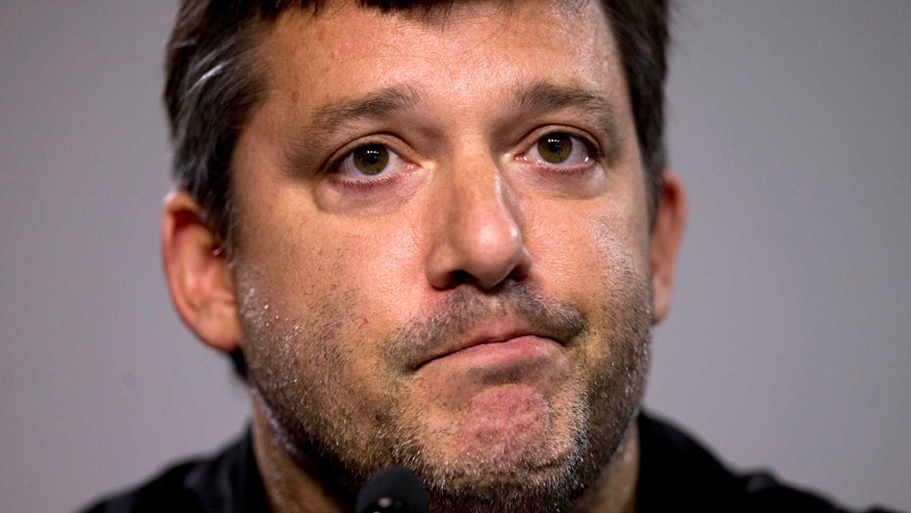 FILE - In this Aug. 29, 2014, file photo, NASCAR auto racing driver Tony Stewart reads a statement during a news conference at Atlanta Motor Speedway in Hampton, Ga. Stewart is scheduled to race Sunday at Watkins Glen International Raceway for the first time since 2012. He missed the 2013 race with a broken leg, then skipped the race last season following the accident in which his sprint car struck and killed Kevin Ward Jr. the night before the race. AP Photo/John Bazemore, File)