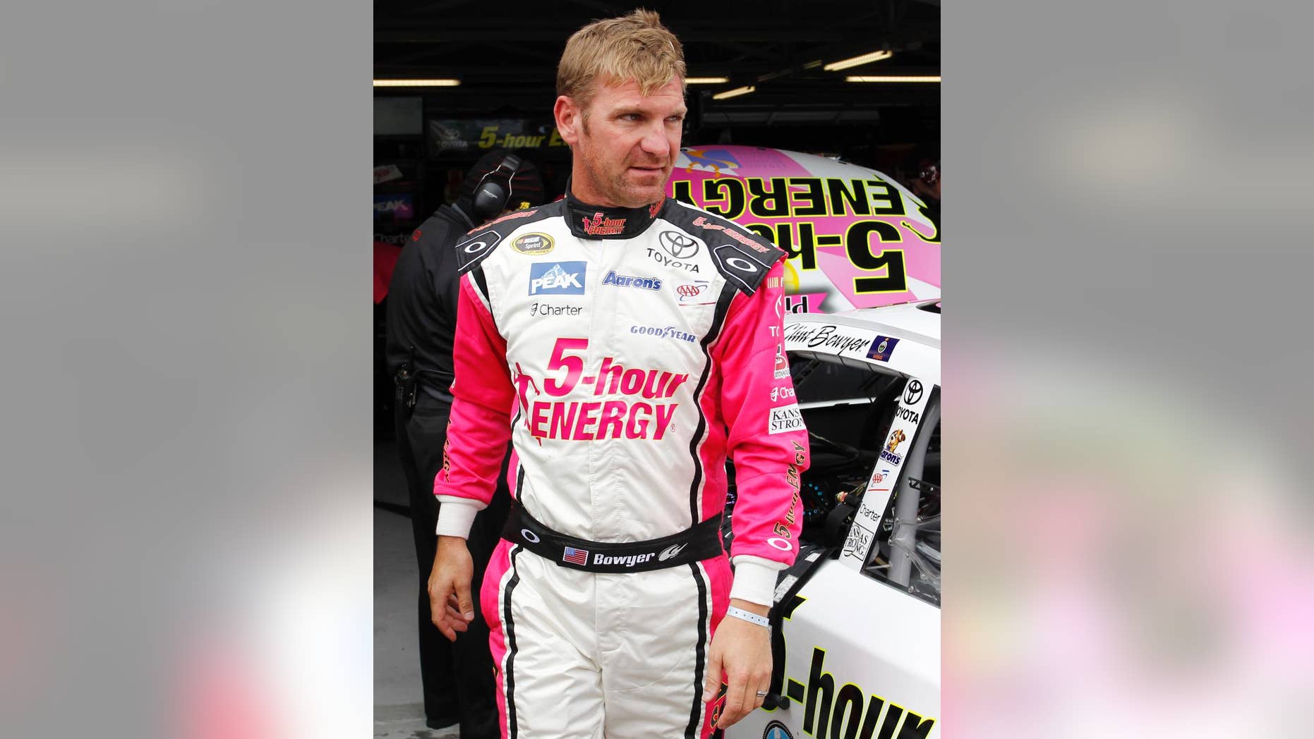 NASCAR auto racing driver Clint Bowyer waits for the start of practice at Kansas Speedway in Kansas City, Kan., Friday, Oct. 3, 2014. (AP Photo/Colin E. Braley)