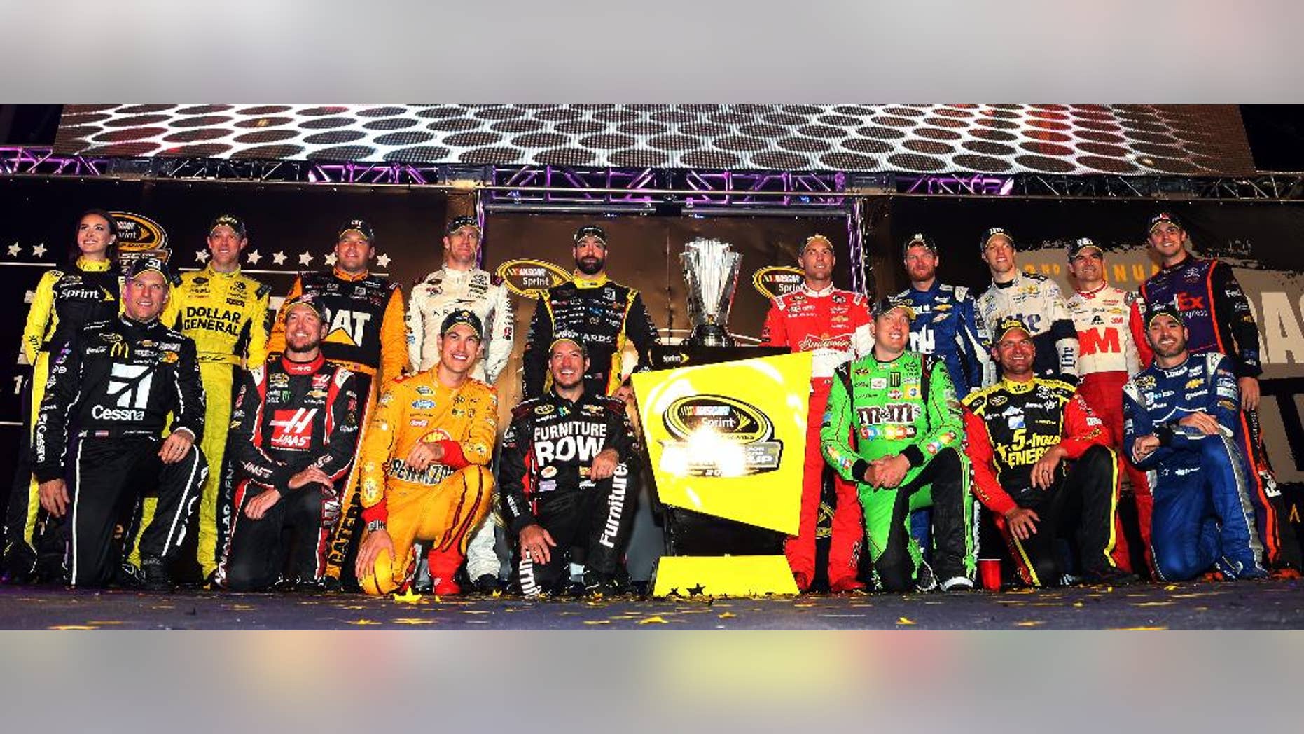 (Back row L-R) Matt Kenseth, driver of the #20 Dollar General Toyota, Ryan Newman, driver of the #31 Caterpillar Chevrolet, Carl Edwards, driver of the #19 ARRIS Toyota, Paul Menard, driver of the #27 Libman/Menards Chevrolet, Kevin Harvick, driver of the #4 Budweiser/Jimmy John's Chevrolet, Dale Earnhardt Jr., driver of the #88 Nationwide Chevrolet, Brad Keselowski, driver of the #2 Miller Lite Ford, Jeff Gordon, driver of the #24 3M Chevrolet, Denny Hamlin, driver of the #11 FedEx Express Toyota, (front row L-R) Jamie McMurray, driver of the #1 Cessna Chevrolet, Kurt Busch, driver of the #41 Haas Automation Chevrolet, Joey Logano, driver of the #22 Shell Pennzoil Ford, Martin Truex Jr., driver of the #78 Furniture Row/Visser Precision Chevrolet, Kyle Busch, driver of the #18 M&M's Crispy/American Heritage Chocolate Toyota, Clint Bowyer, driver of the #15 5-hour Energy Toyota, and Jimmie Johnson, driver of the #48 Lowe's Chevrolet, pose for a photo after making the Chase for the Sprint Cup after the NASCAR Sprint Cup Series Federated Auto Parts 400 at Richmond International Raceway Saturday, Sept. 12, 2015 in Richmond, Virginia. (Matt Sullivan/NASCAR via AP)