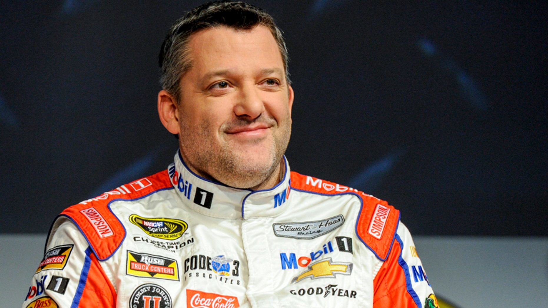 FILE - In this Thursay, Jan. 21, 2016, file photo, Stewart Haas Racing co-owner and driver Tony Stewart talks to members of the media during the NASCAR Charlotte Motor Speedway Media Tour in Charlotte, N.C. The three-time NASCAR champion has been hospitalized with a back injury after a non-racing accident on Sunday and Stewart-Haas Racing is unsure of the extent of his injuries, a team spokesman told The Associated Press, Tuesday, Feb. 2, 2016. (AP Photo/Mike McCarn, File)
