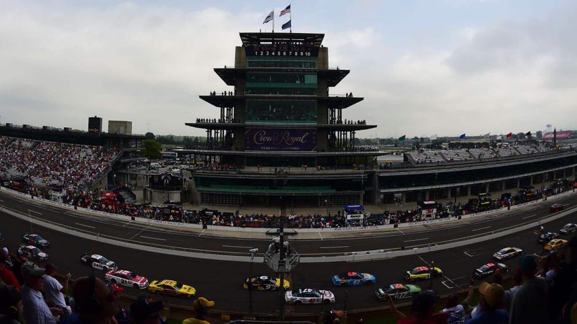 Drivers race by the Pagoda during the NASCAR Sprint Cup Series Crown Royal Presents The John Wayne Walding 400 at the Brickyard Indianapolis Motor Speedway on July 27, 2014 in Indianapolis, Indiana.