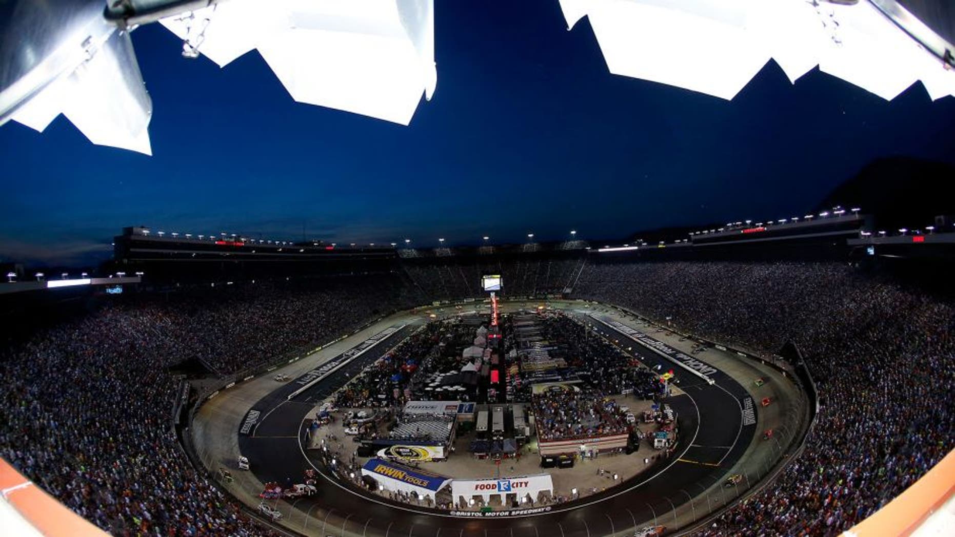BRISTOL, TN - AUGUST 23: Cars race during the NASCAR Sprint Cup Series Irwin Tools Night Race at Bristol Motor Speedway on August 23, 2014 in Bristol, Tennessee. (Photo by Tom Pennington/NASCAR via Getty Images)
