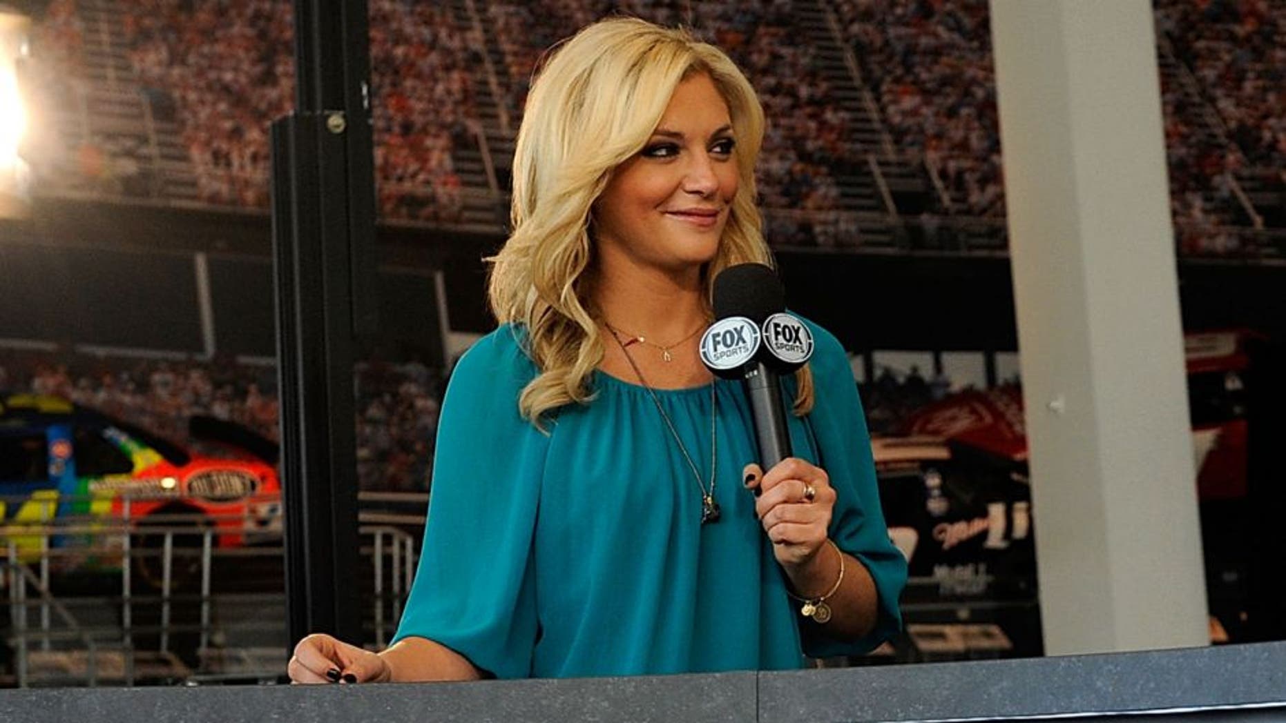 CHARLOTTE, NC - OCTOBER 21: Brad Keselowski, driver of the #2 Miller Lite Ford, speaks with Fox Sports 1 anchor Danielle Trotta during the NASCAR Eliminator Round Media Day at NASCAR Hall of Fame on October 21, 2014 in Charlotte, North Carolina. (Photo by Jared C. Tilton/NASCAR via Getty Images)