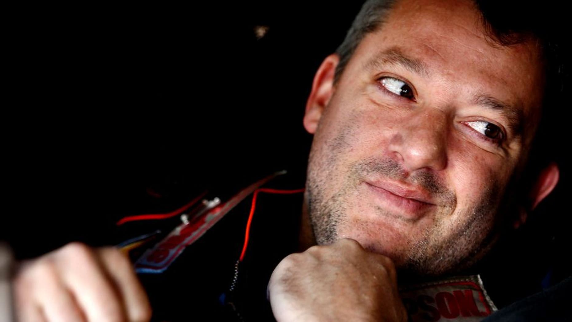 MARTINSVILLE, VA - OCTOBER 30: Tony Stewart, driver of the #14 Bass Pro Shops/Mobil 1 Chevrolet, sits in his car in the garage area during practice for the NASCAR Sprint Cup Series Goody's Headache Relief Shot 500 at Martinsville Speedway on October 30, 2015 in Martinsville, Virginia. (Photo by Jeff Zelevansky/Getty Images)