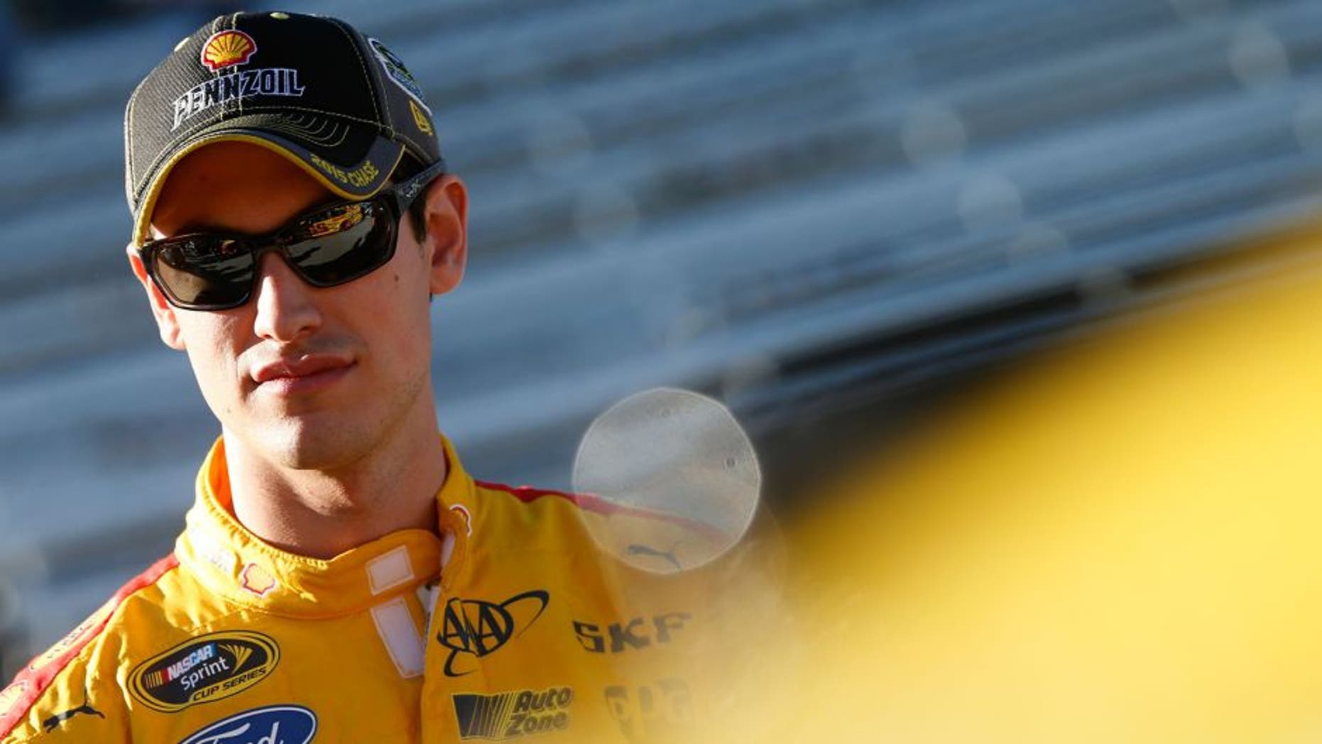 MARTINSVILLE, VA - OCTOBER 30: Joey Logano, driver of the #22 Shell Pennzoil Ford, stands on the grid during qualifying for the NASCAR Sprint Cup Series Goody's Headache Relief Shot 500 at Martinsville Speedway on October 30, 2015 in Martinsville, Virginia. (Photo by Brian Lawdermilk/NASCAR via Getty Images)