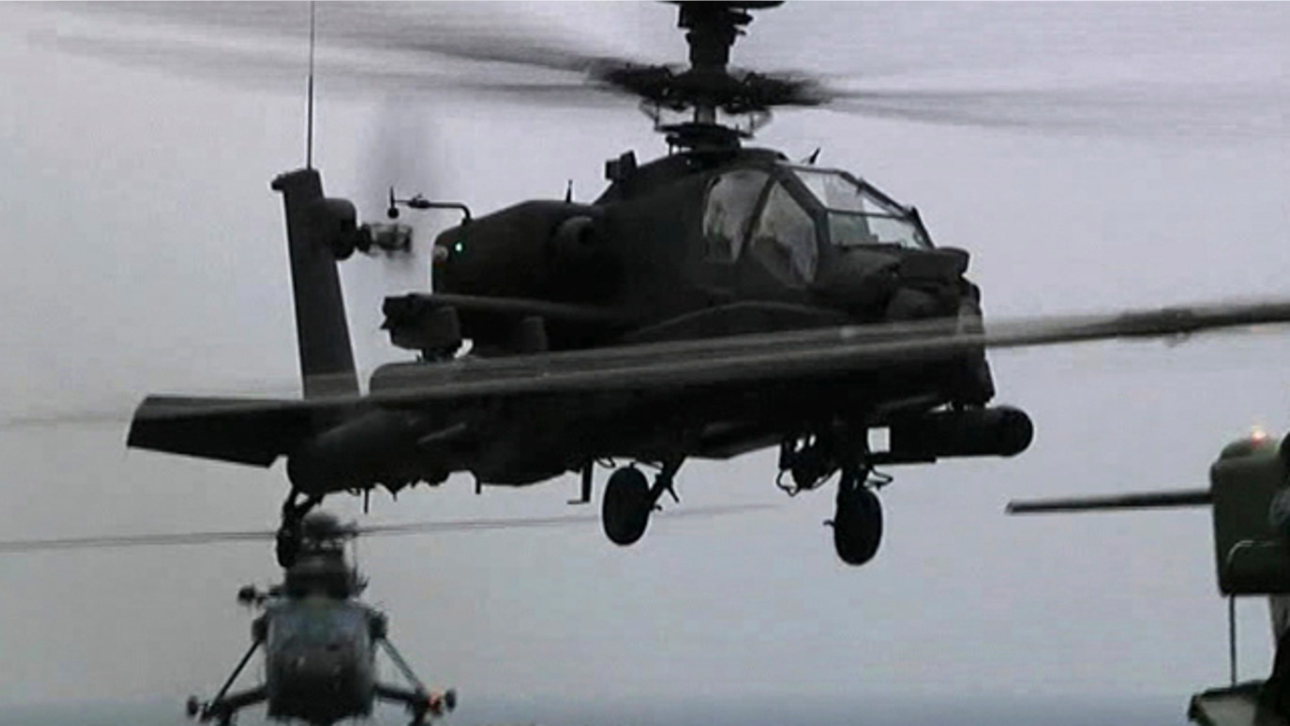 June 4: This image taken from video and made available by the British Ministry of Defense, MOD, shows a British Apache helicopter taking off from the deck of the HMS Ocean in the Mediterranean Sea, off Libya.