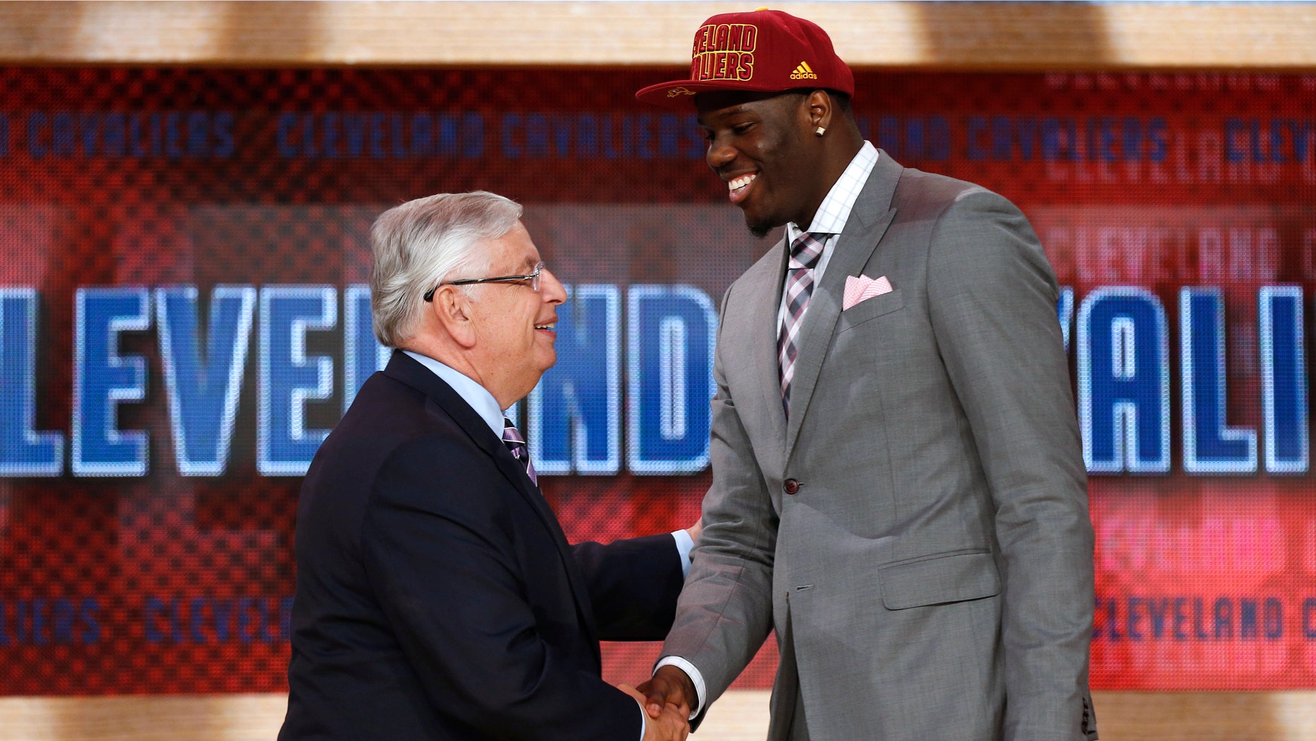 NBA Commissioner David Stern, left, shakes hands with UNLV's Anthony Bennett, who was selected first overall by the Cleveland Cavaliers in the NBA basketball draft, Thursday, June 27, 2013, in New York. (AP Photo/Jason DeCrow)