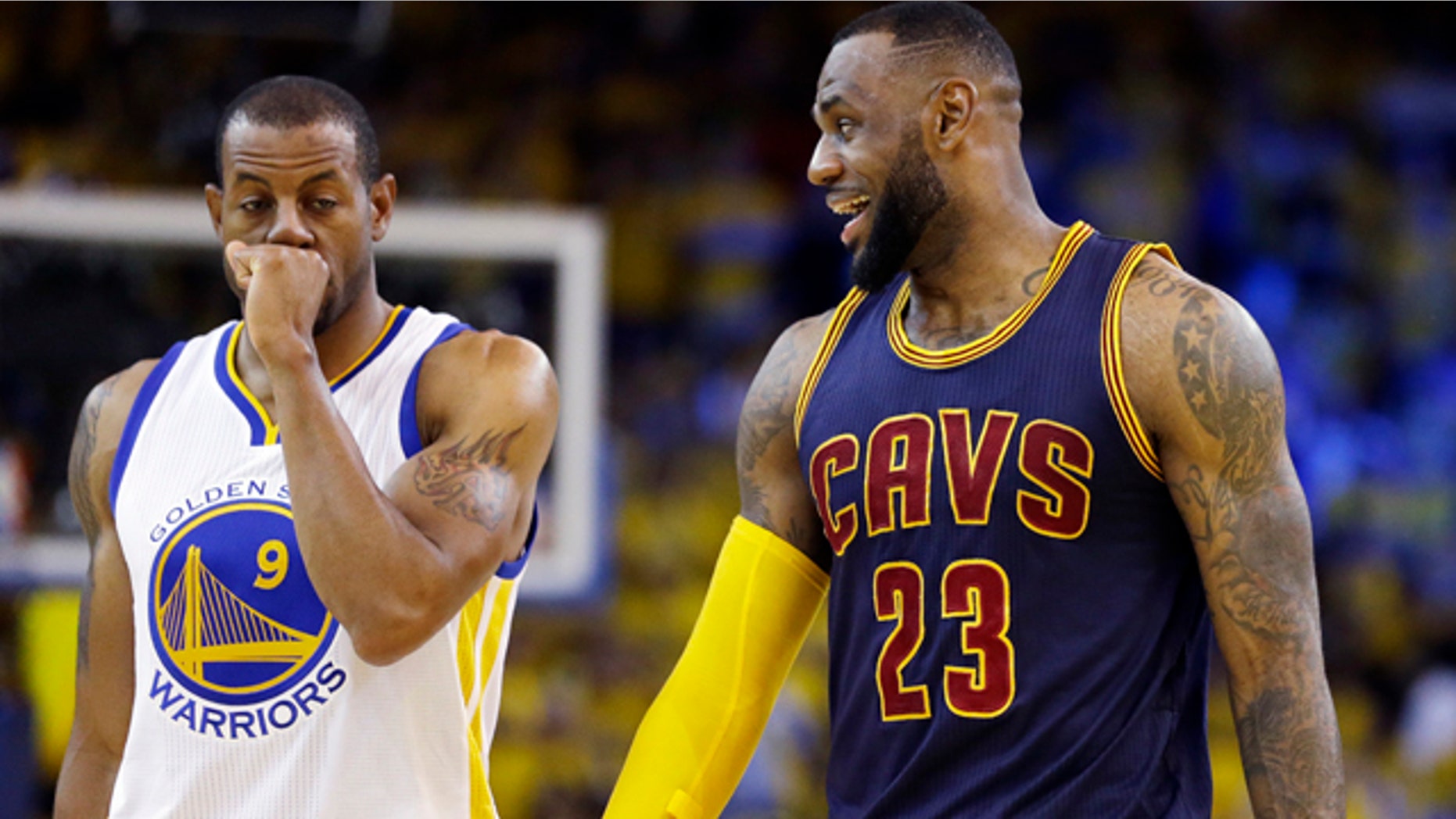 June 7, 2015: Cleveland Cavaliers forward LeBron James (23) smiles next to Golden State Warriors forward Andre Iguodala (9) during the second half of Game 2 of basketball's NBA Finals in Oakland, Calif. (AP Photo/Ben Margot)