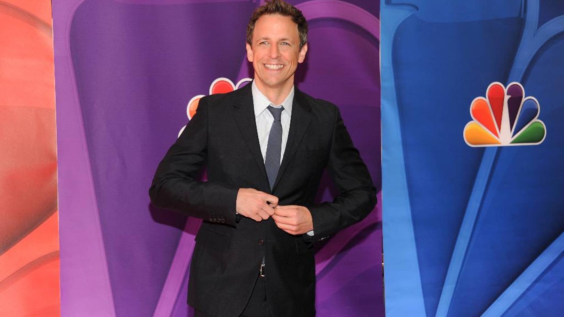 FILE - Seth Meyers attends the NBC Network 2013 Upfront at Radio City Music Hall, in this May 13, 2013 file photo taken in New York. NBC, home to Meyers in his long stint on “Saturday Night Live” and his new late-night talk show, announced late Thursday April 24, 2014 that he’ll host the 66th edition of the Emmys set to air on the network August 25. (Photo by Evan Agostini/Invision/AP, File)
