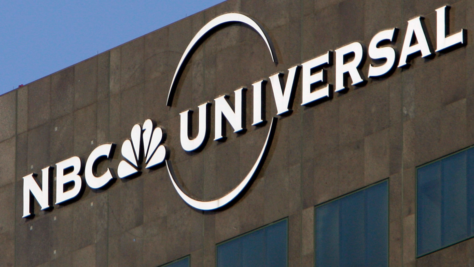 Dec. 3, 2009. The NBC Universal logo hangs on a building in Los Angeles.