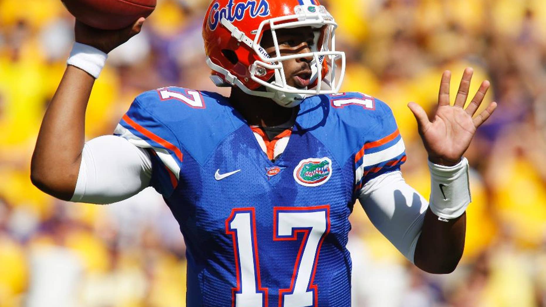 FILE - In this Oct. 8, 2011 file photo, Florida quarterback Jacoby Brissett (17) throws a pass in the first half of an NCAA college football game against LSU in Baton Rouge, La. Brissett knows he will face big expectations when he finally takes a snap for North Carolina State. Brissett, who has two years of eligibility remaining, takes over a team that won three games and went winless in the Atlantic Coast Conference for the first time since 1959. (AP Photo/Jonathan Bachman, File)