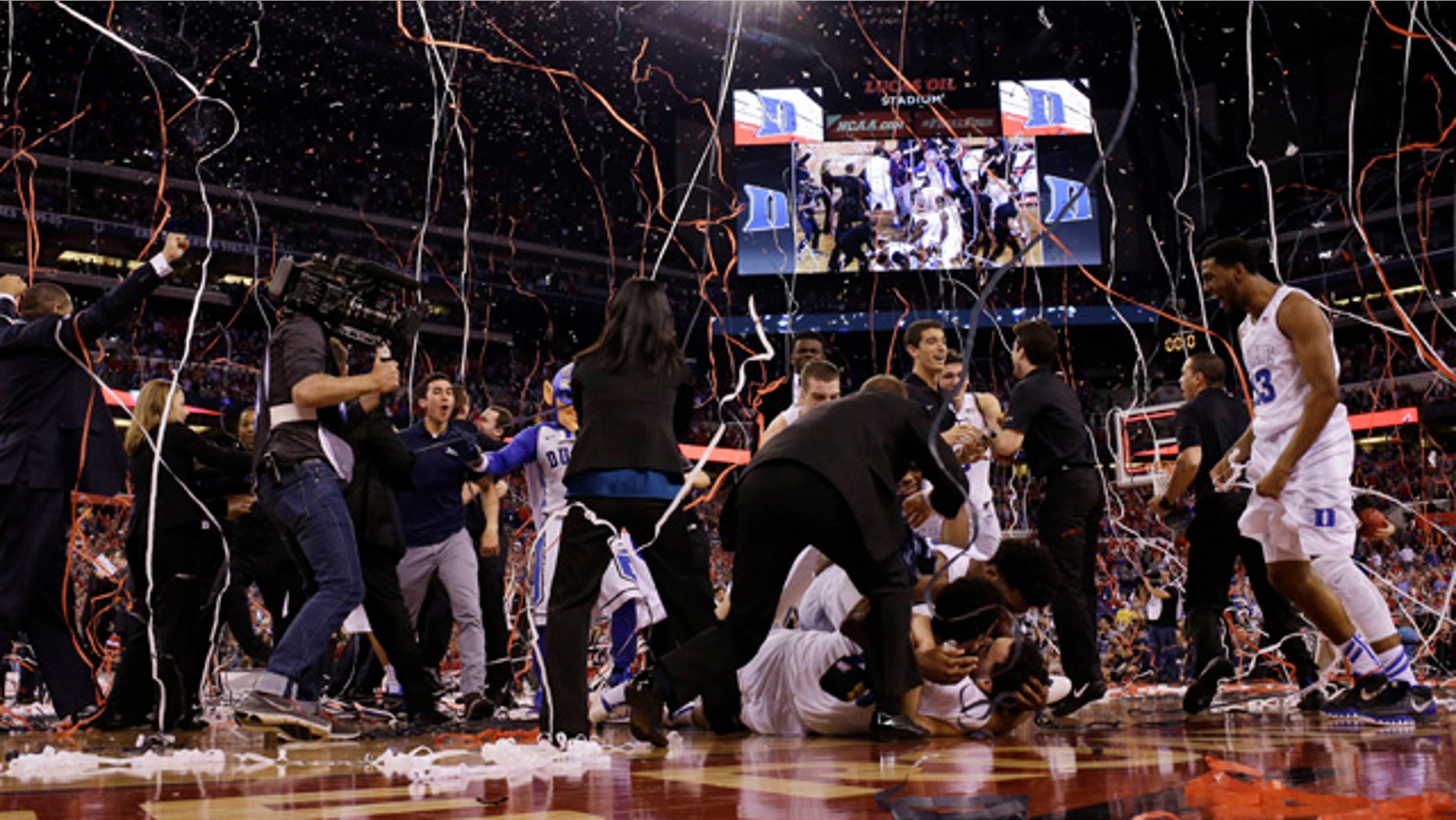 April 6, 2015: Duke players celebrate their 68-63 victory over Wisconsin in the NCAA Final Four college basketball tournament championship game in Indianapolis. (AP Photo/David J. Phillip)