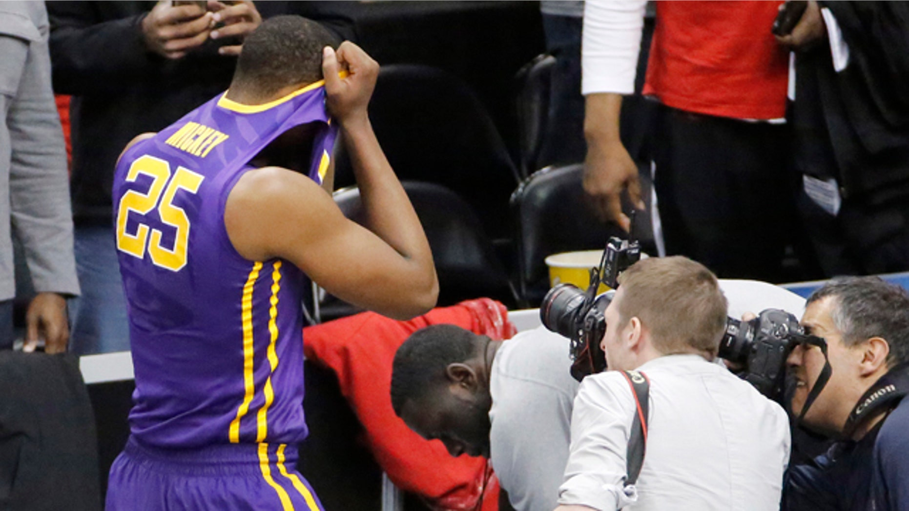 March 19, 2015: LSU's Jordan Mickey (25) leaves the court after his team lost 66-65 to North Carolina State in an NCAA tournament second round game in Pittsburgh. (AP Photo/Gene J. Puskar)