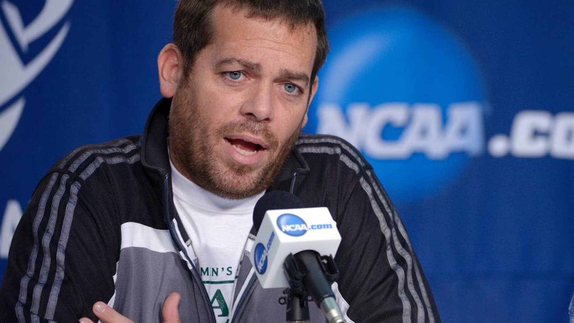 Manhattan coach Steve Masiello speaks during a news conference for the NCAA men's college basketball tournament, Wednesday, March 19, 2014, in Orlando, Fla. Manhattan will play Louisville in a second-round game Thursday. (AP Photo/Phelan Ebenhack)