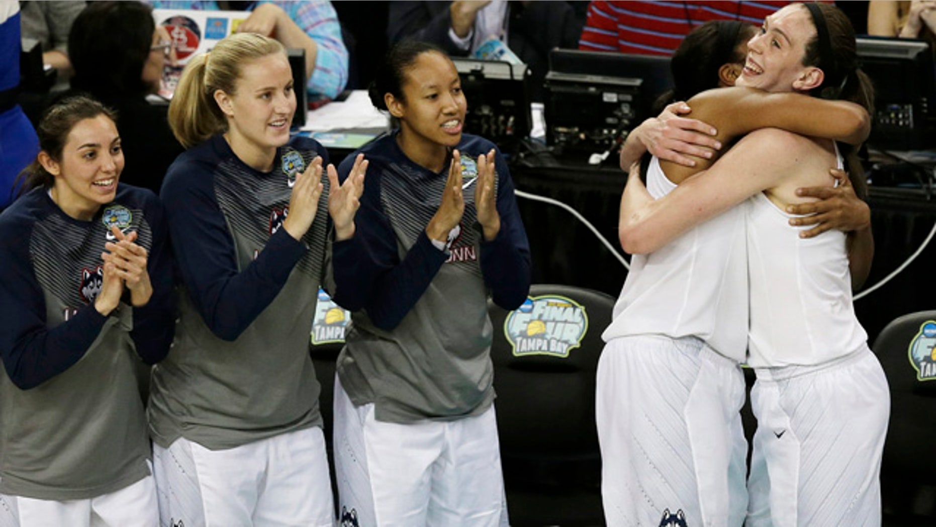 April 7, 2015: Connecticut forward Breanna Stewart (30) and Connecticut forward Morgan Tuck (3) celebrate after the second half of the NCAA women's college basketball championship game against Notre Dame. Connecticut won 63-53. (AP Photo/Chris O'Meara)