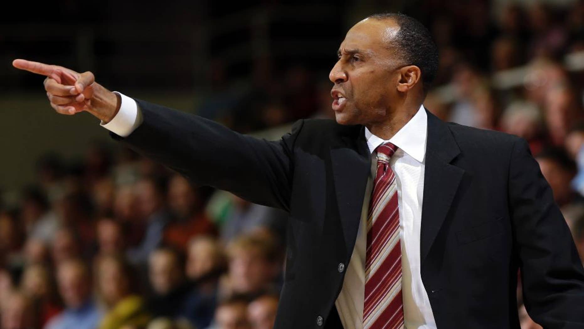 FILE - In this Feb. 20, 2014 file photo, Stanford head coach Johnny Dawkins argues a call during the first half of an NCAA college basketball game against Southern California, in Stanford, Calif. Dawkins is back on college basketball's big stage _ for the first time as a head coach after some special runs as a player. (AP Photo/Marcio Jose Sanchez, File)