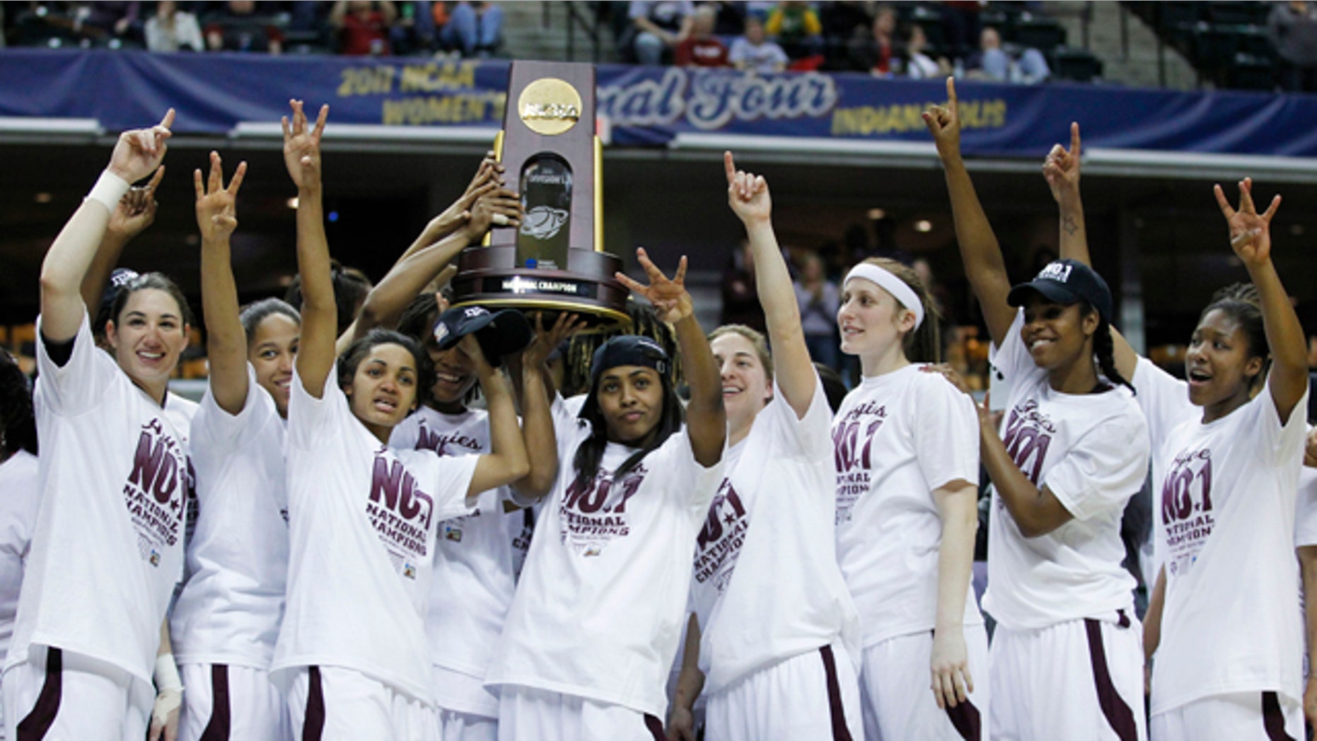 April 5: Texas A&M players celebrate with the trophy after their 76-70 win over Notre Dame in the women's NCAA Final Four college basketball championship game in Indianapolis.
