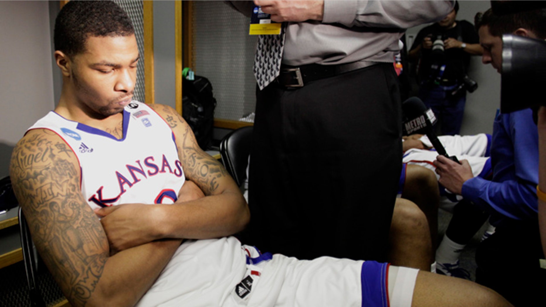 March 27, 2011: Kansas' Elijah Marcus Morris reacts in the locker room after losing 71-61 to Virginia Commonwealth at the Southwest regional final game in the NCAA college basketball tournament.
