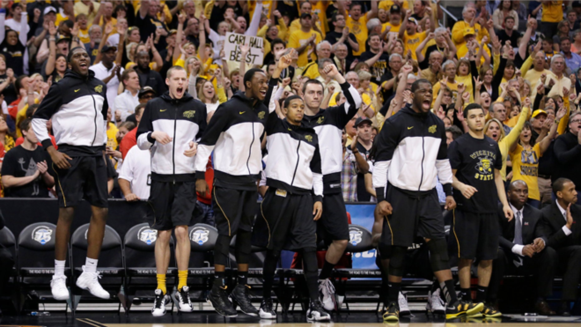 March 30, 2013: Wichita State players react to a field goal scored against Ohio State during the second half of the West Regional final in the NCAA men's college basketball tournament in Los Angeles.