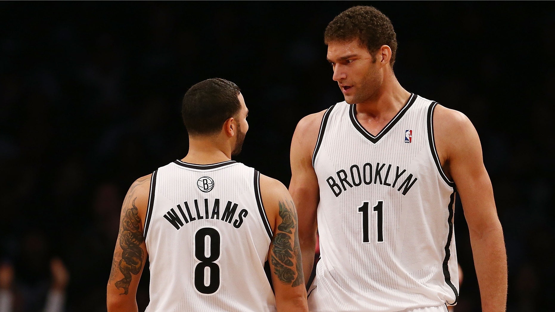 NEW YORK, NY - NOVEMBER 03: Brook Lopez #11 of the Brooklyn Nets speaks with teammate Deron Williams #8 during a game against the Toronto Raptors at the Barclays Center on November 3, 2012 in the Brooklyn borough of New York City. NOTE TO USER: User expressly acknowledges and agrees that, by downloading and/or using this photograph, user is consenting to the terms and conditions of the Getty Images License Agreement. (Photo by Alex Trautwig/Getty Images)