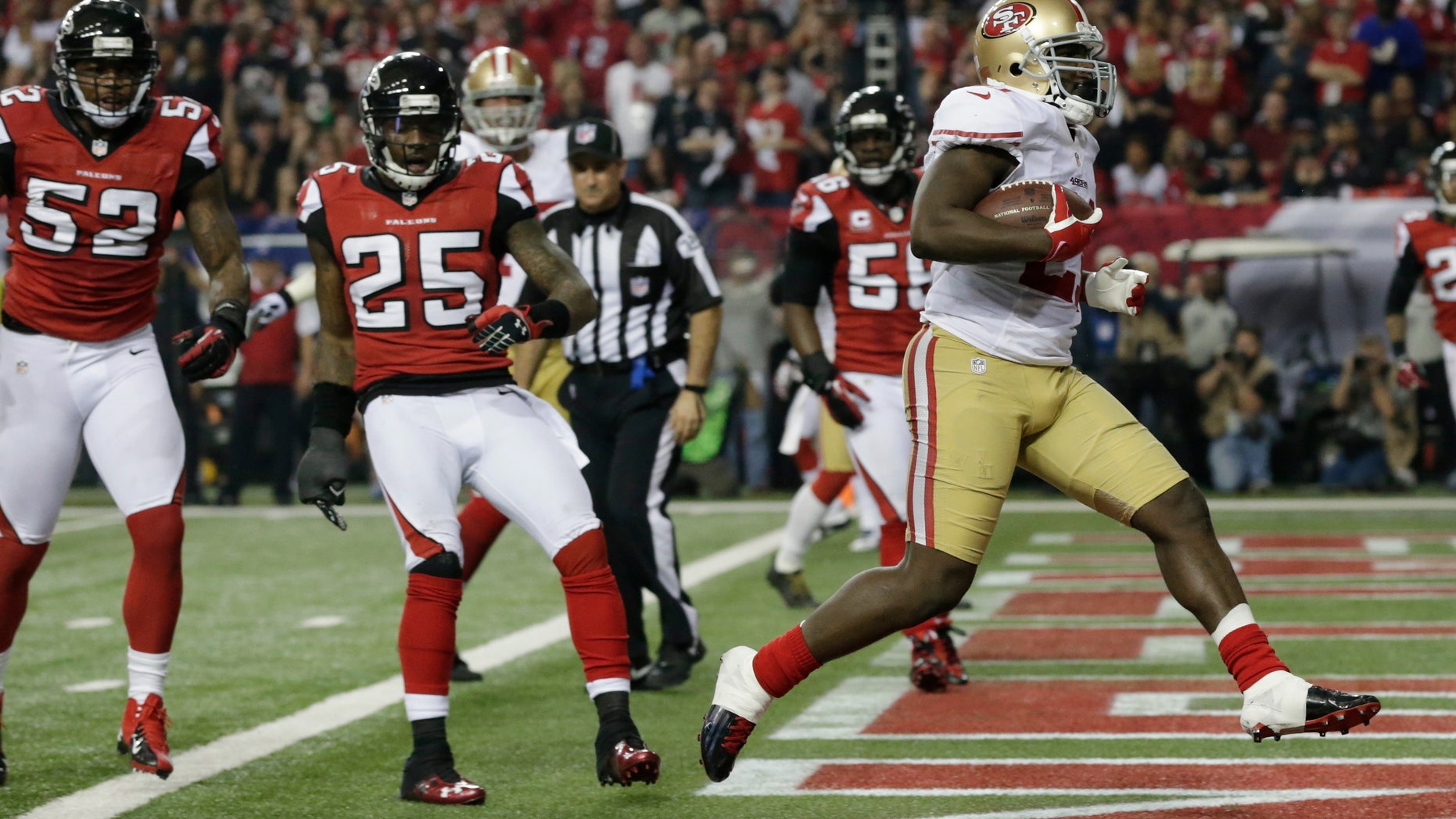 Jan. 20, 2013: San Francisco 49ers' Frank Gore rushes for a five-yard touchdown during the second half of the NFL football NFC Championship game against the Atlanta Falcons in Atlanta. Left is Atlanta Falcons' Akeem Dent and William Moore.