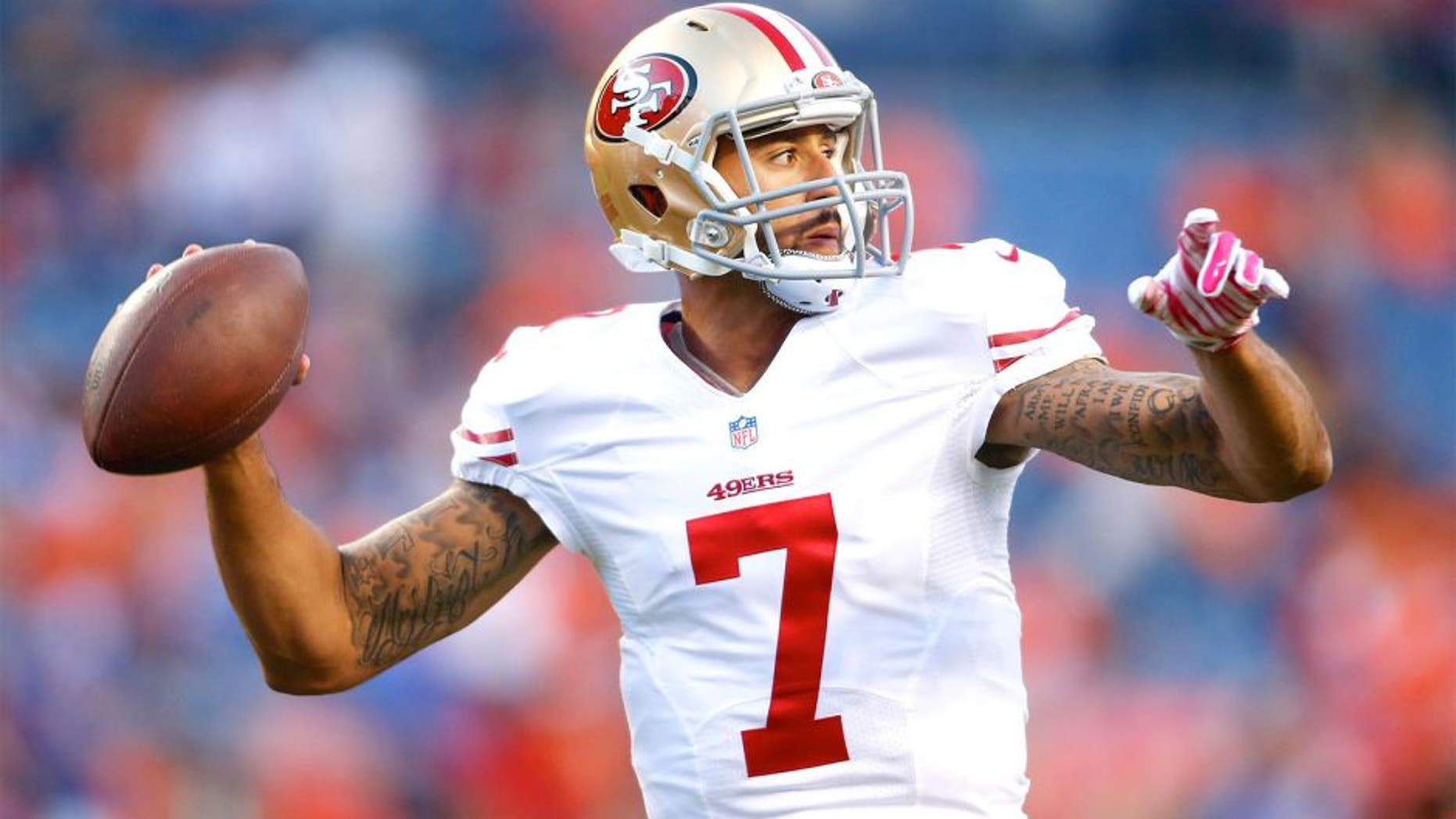 Oct 19, 2014; Denver, CO, USA; San Francisco 49ers quarterback Colin Kaepernick (7) prior to the game against the Denver Broncos at Sports Authority Field at Mile High. Mandatory Credit: Chris Humphreys-USA TODAY Sports