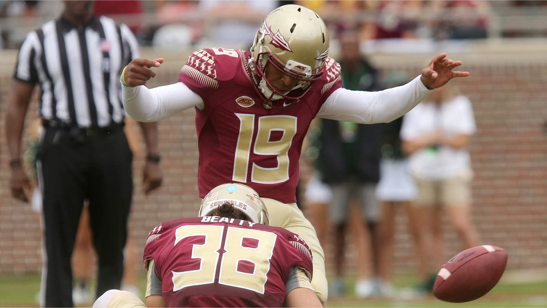 FILE - In this Sept. 12, 2015, file photo, Florida State's Roberto Aguayo kicks an extra point from the hold of Cason Beatty during an NCAA college football game against South Florida in Tallahassee, Fla. Aguayo, who is the most accurate kicker in NCAA history, could be the first kicker in 10 years to be selected in the first three rounds of the NFL Draft. (AP Photo/Steve Cannon, File)