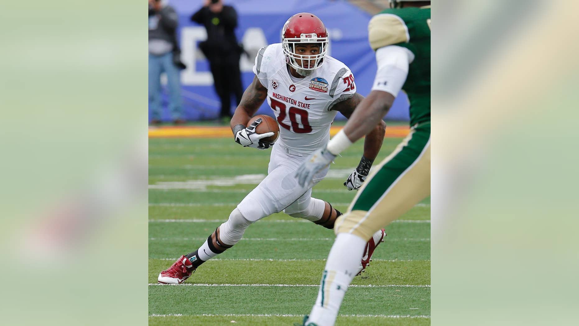 FILE - In this Dec. 21, 2013, file photo, Washington State safety Deone Bucannon (20) runs back an interception during the first half of the NCAA New Mexico Bowl college football game against Colorado State in Albuquerque, N.M. Bucannon was selected in the first round, 27th overall, by the Arizona Cardinals in the NFL draft on Thursday, May 8, 2014. (AP Photo/Matt York, File)