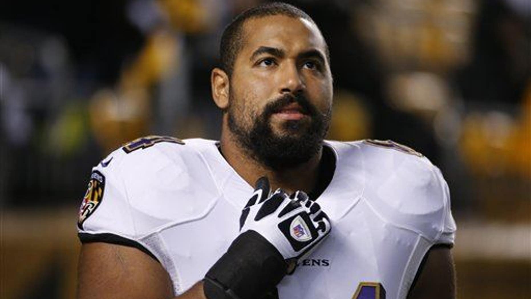 Baltimore Ravens offensive lineman John Urschel warms up before a game.
