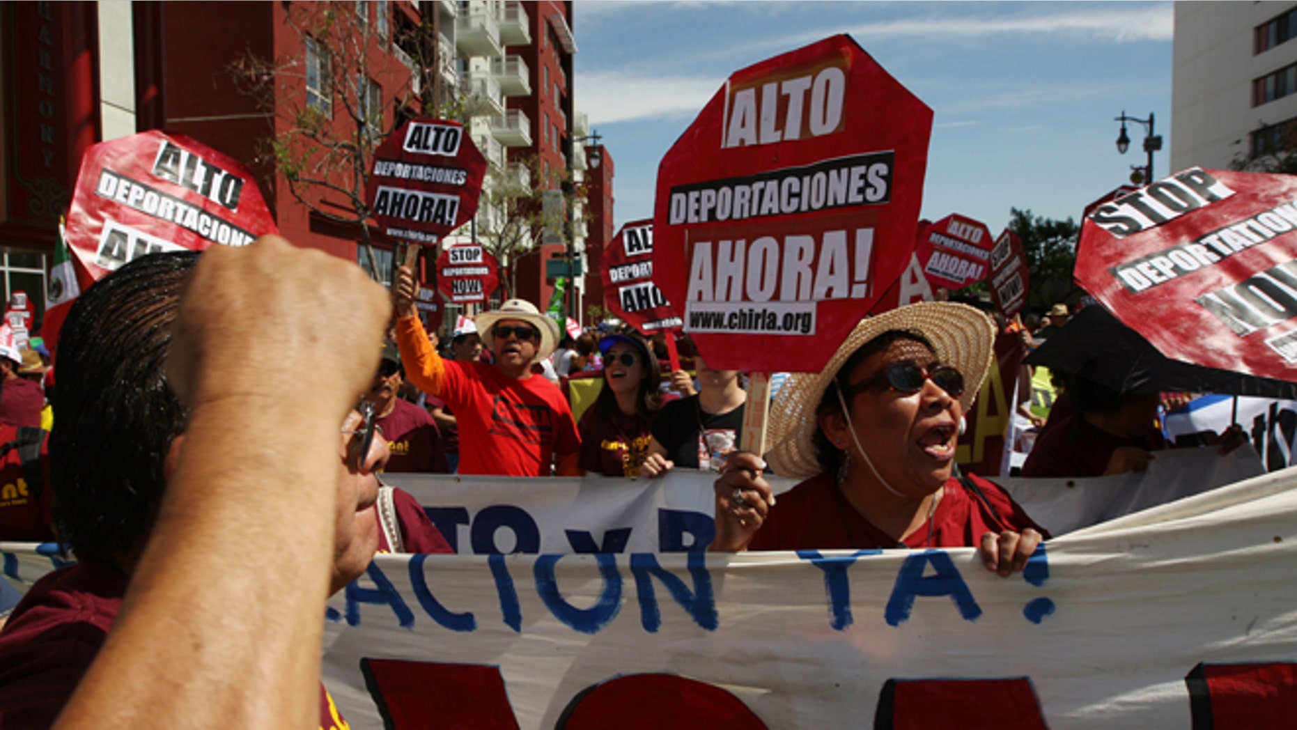 LOS ANGELES, CA - MAY 1: People chant before marching to the Metropolitan Detention Center during one a several May Day immigration-themed events on May 1, 2014 in Los Angeles, California. Demonstrators are calling for immigration reform and an end to deportations of undocumented residents. (Photo by David McNew/Getty Images)