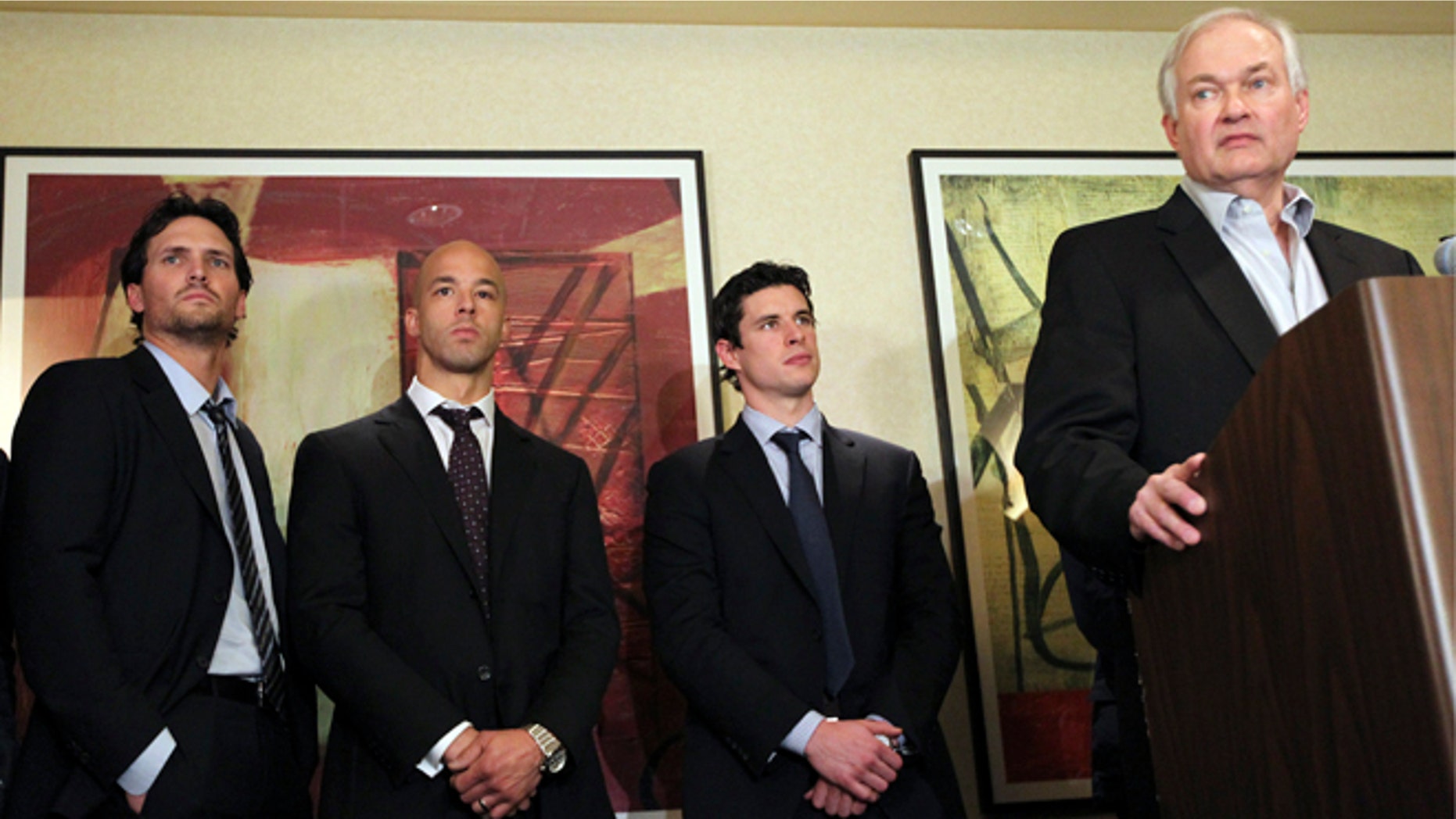 Dec. 6, 2012: Winnipeg Jets' Ron Hainsey, left, Vancouver Canucks' Manny Malhotra, second from left, and Pittsburgh Penguins' Sidney Crosby, second from right, listens as Don Fehr, right, executive director for the National Hockey League Players Associations, speaks to reporters in New York.