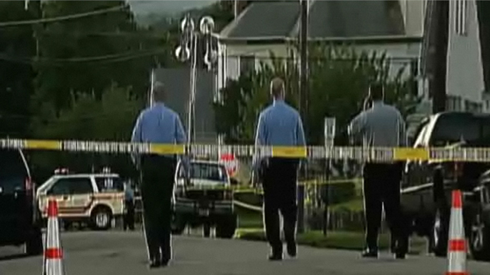 New Jersey police inspect the scene of a shooting that claimed the life of a woman.