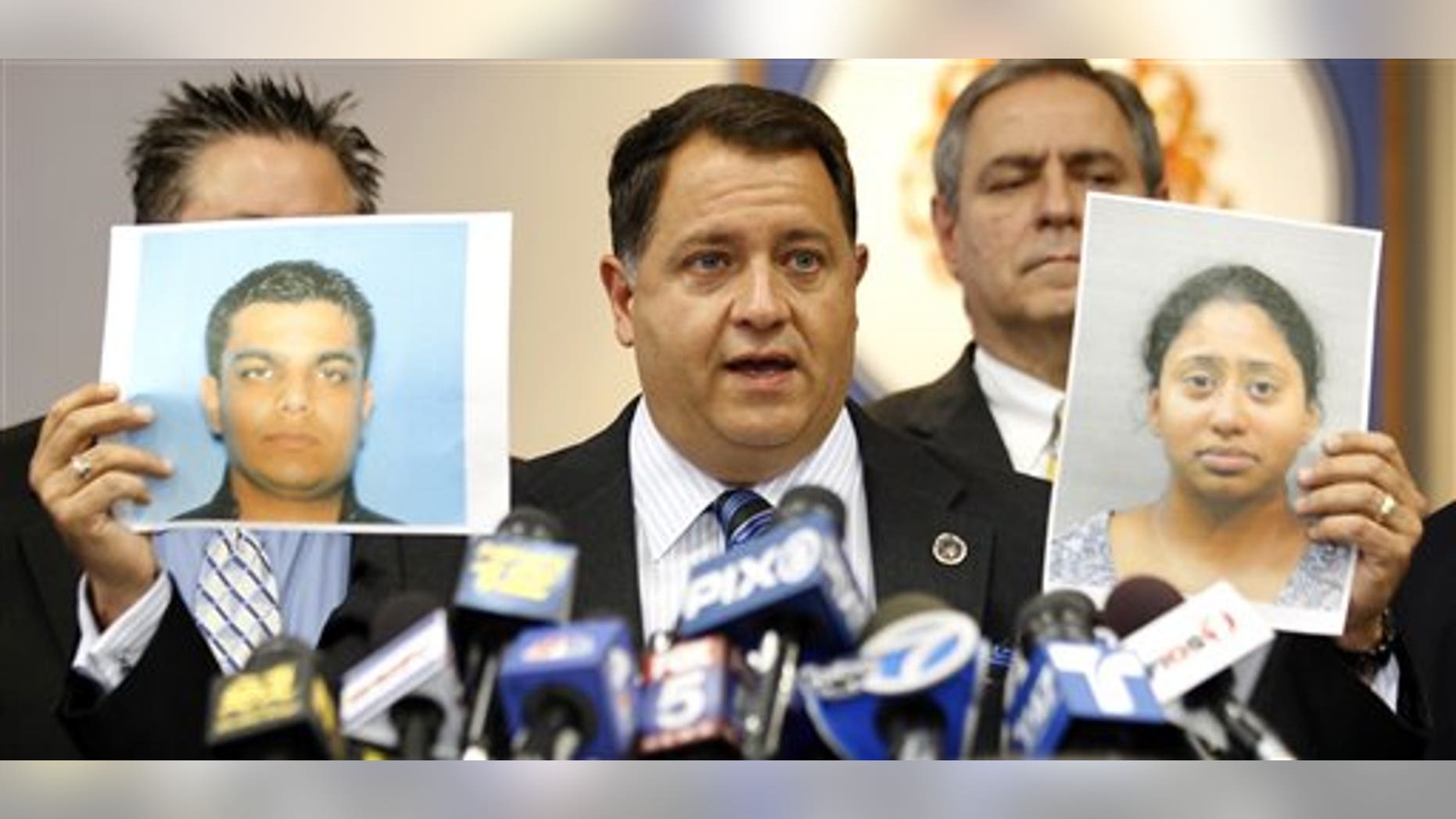 August 19: Morris County Prosecutor Robert Bianchi holds the police booking photos of Kashif Parvaiz, left, and Antoinette Stephen, who were charged in the murder of 27-year-old Nazish Noorani, during a news conference in Morristown, N.J.