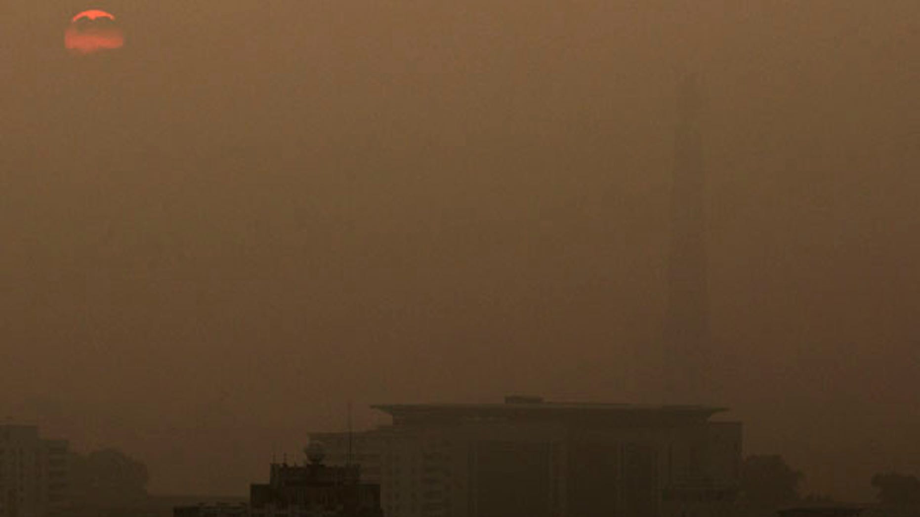 June 25, 2013: The Juche Tower stands in fog at sunrise in Pyongyang, North Korea.