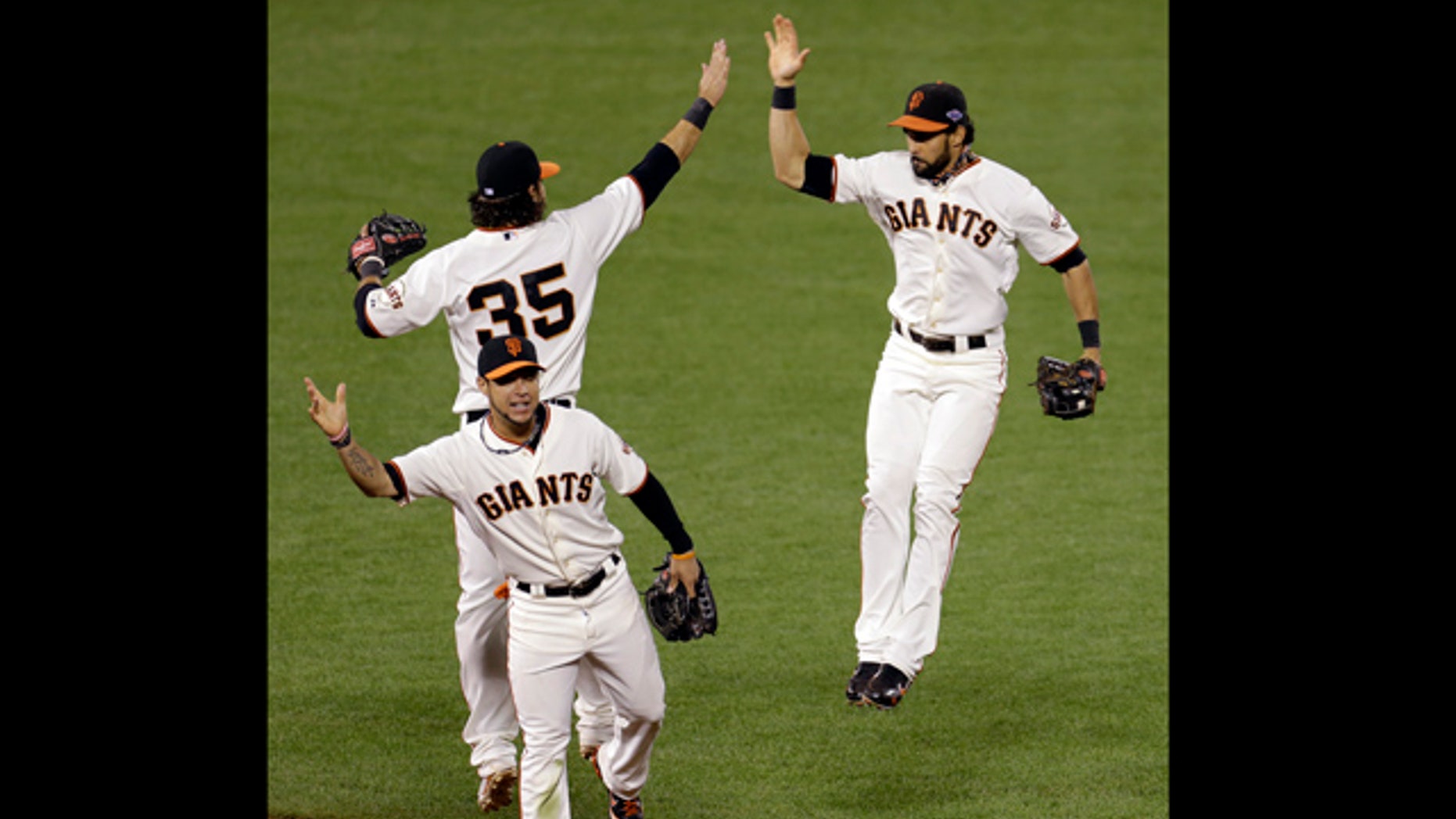 Oct. 21, 2012: San Francisco Giants' Brandon Crawford (35), Angel Pagan, right, and Gregor Blanco celebrate after Game 6 of baseball's National League championship series against the St. Louis Cardinals in San Francisco. The Giants won 6-1 to tie the series at 3-3.