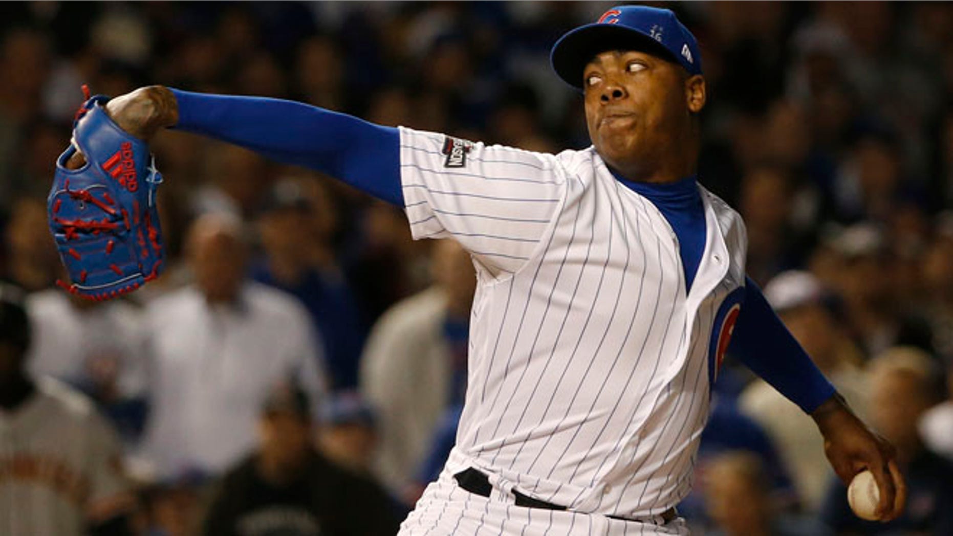 Chicago Cubs relief pitcher Aroldis Chapman (54) throws in the ninth inning of Game 2 of baseball's National League Division Series against the San Francisco Giants, Saturday, Oct. 8, 2016, in Chicago. (AP Photo/Nam Y. Huh)